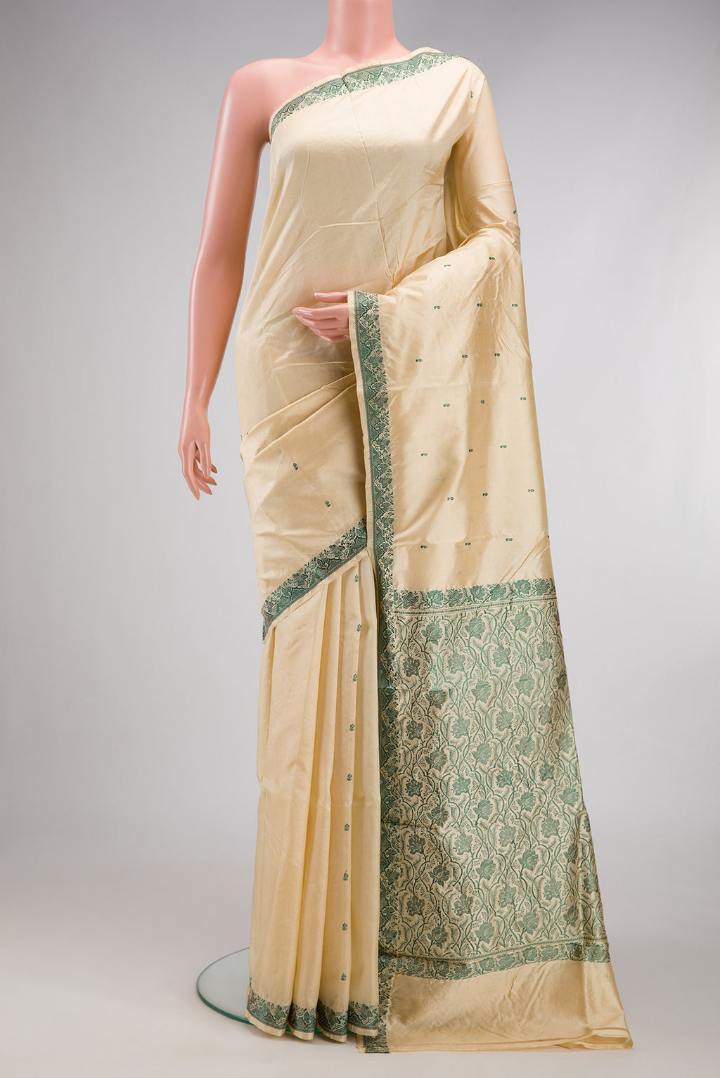 Sandal Banarasi Silk Saree with Thread Butta on the body and Thread Border.  displayed on a mannequin