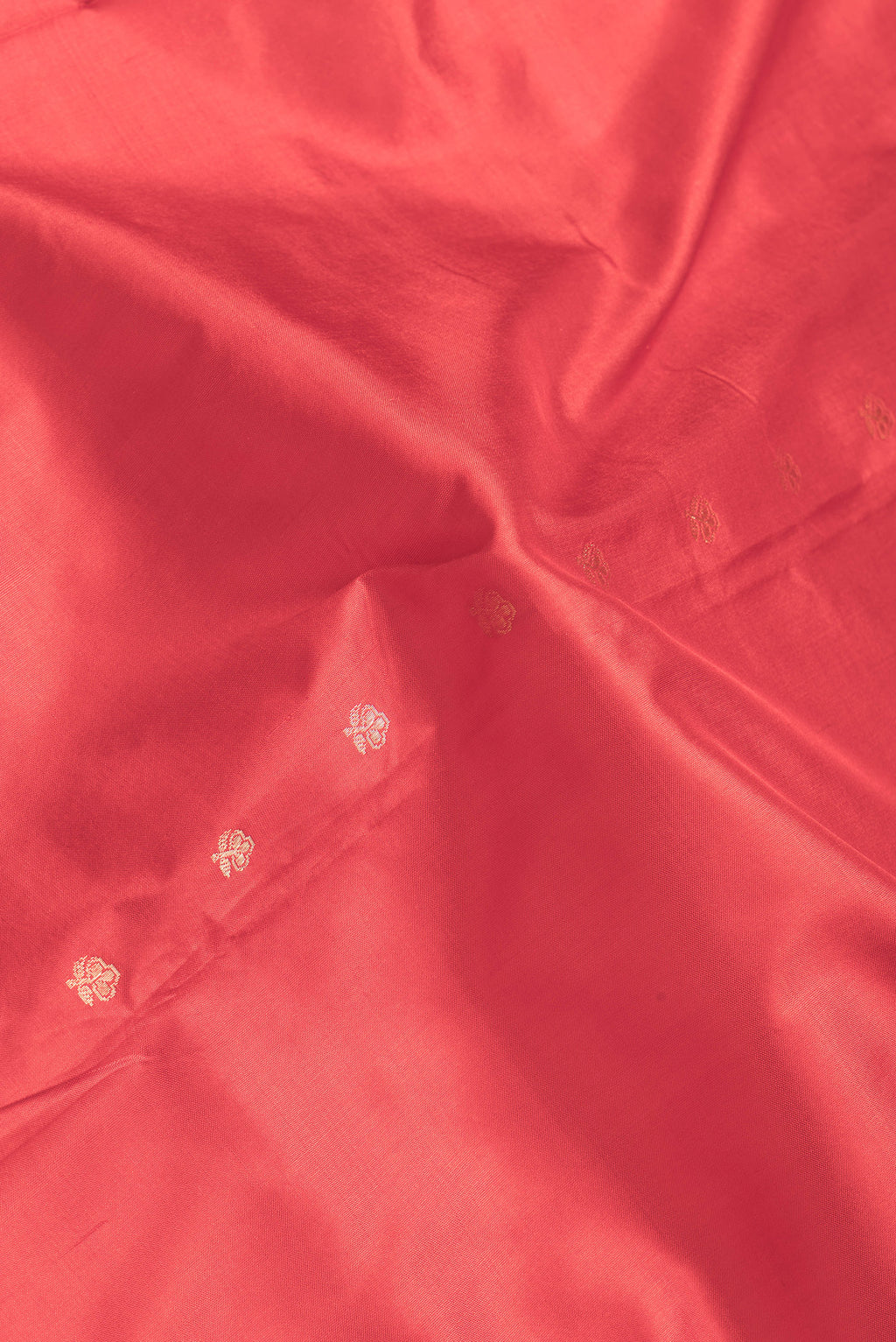 Close up of Red Dual Tone Banarasi Silk Saree with Zari Butta on the body and Zari Border.  displaying folds
