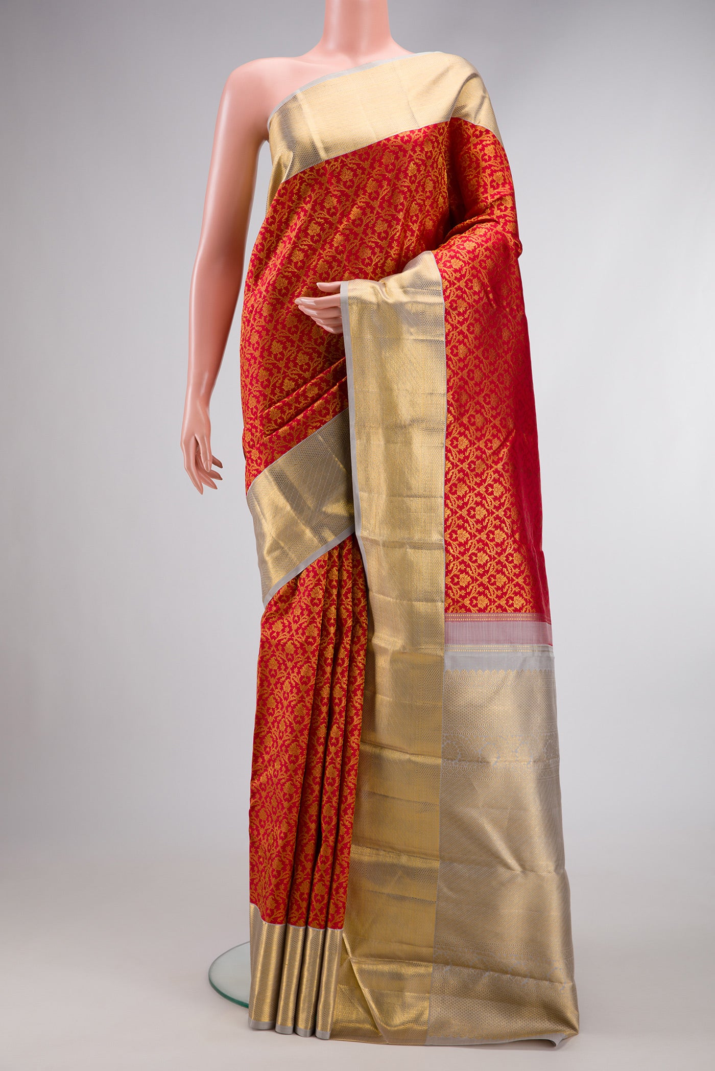 Red Dual Tone Kanchipuram Silk Saree with Zari Brocade on the body and Zari Border.  displayed on a mannequin