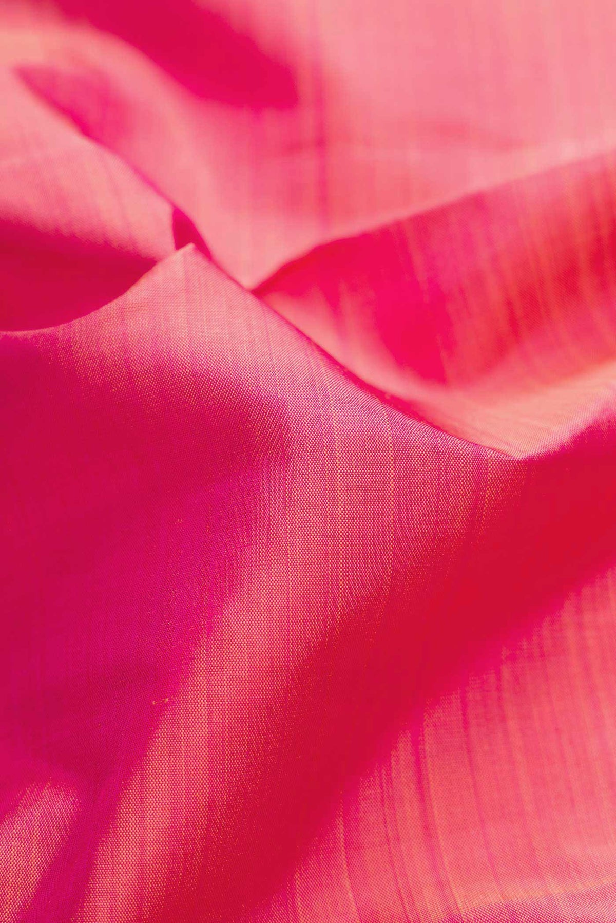 Close up of Pure Silk Pure Zari Pink Dual Tone Kanchipuram Saree with Plain Body and Zari Border displaying folds