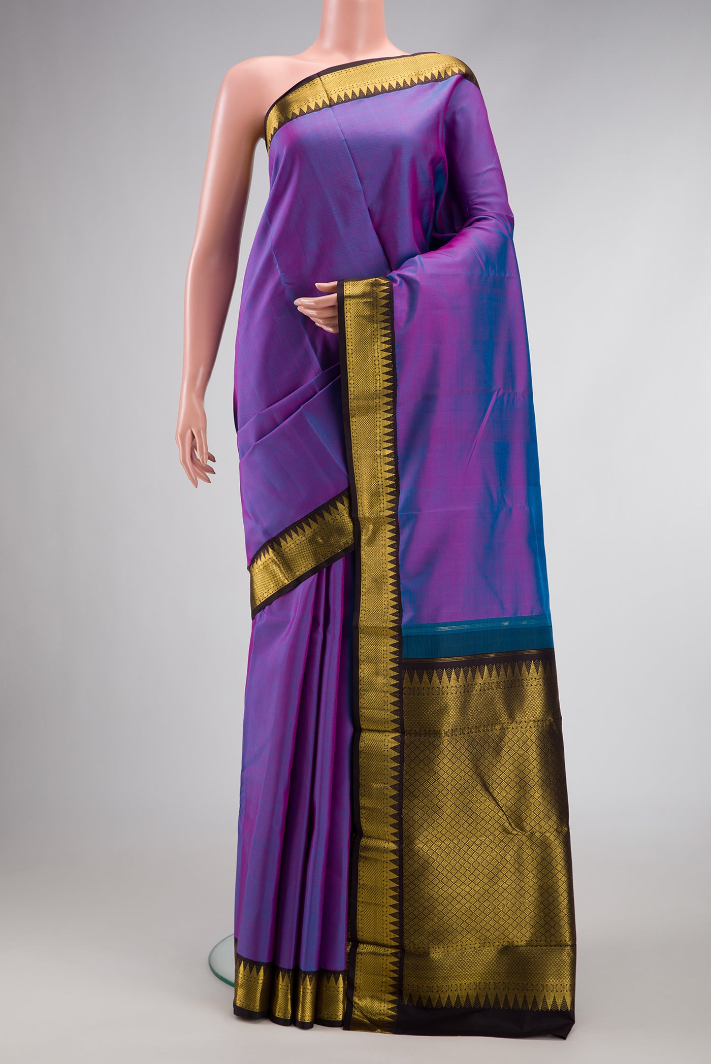 Lavender Dual Tone Kanjivaram Silk Saree with Plain Body and Zari Border.  displayed on a mannequin