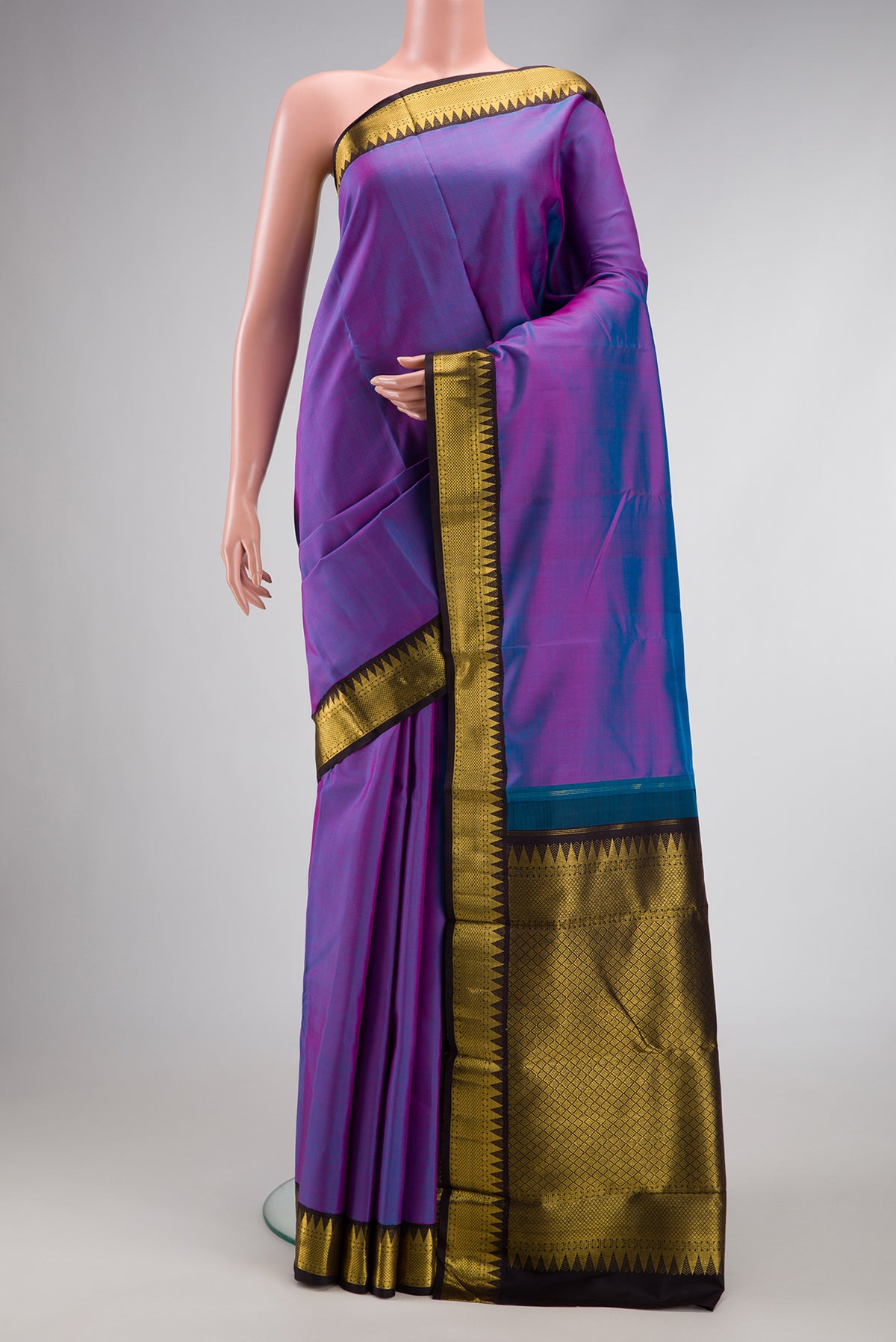 Lavender Dual Tone Kanjivaram Silk Saree with Plain Body and Zari Border.  displayed on a mannequin