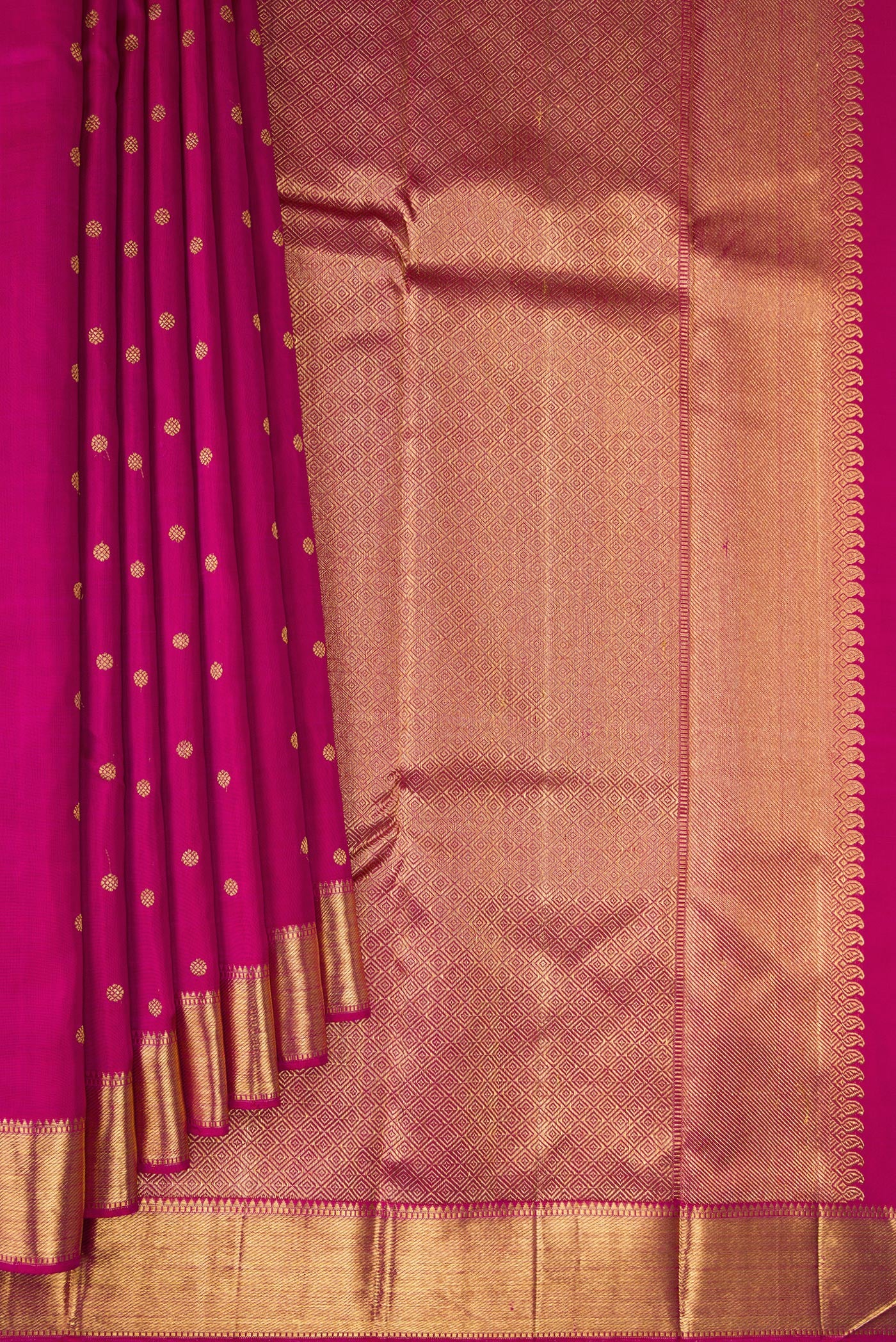 Pleats and pallu of Pure Silk Pure Zari Magenta Kanjivaram Saree with Zari Butta on the body and Zari Border. 