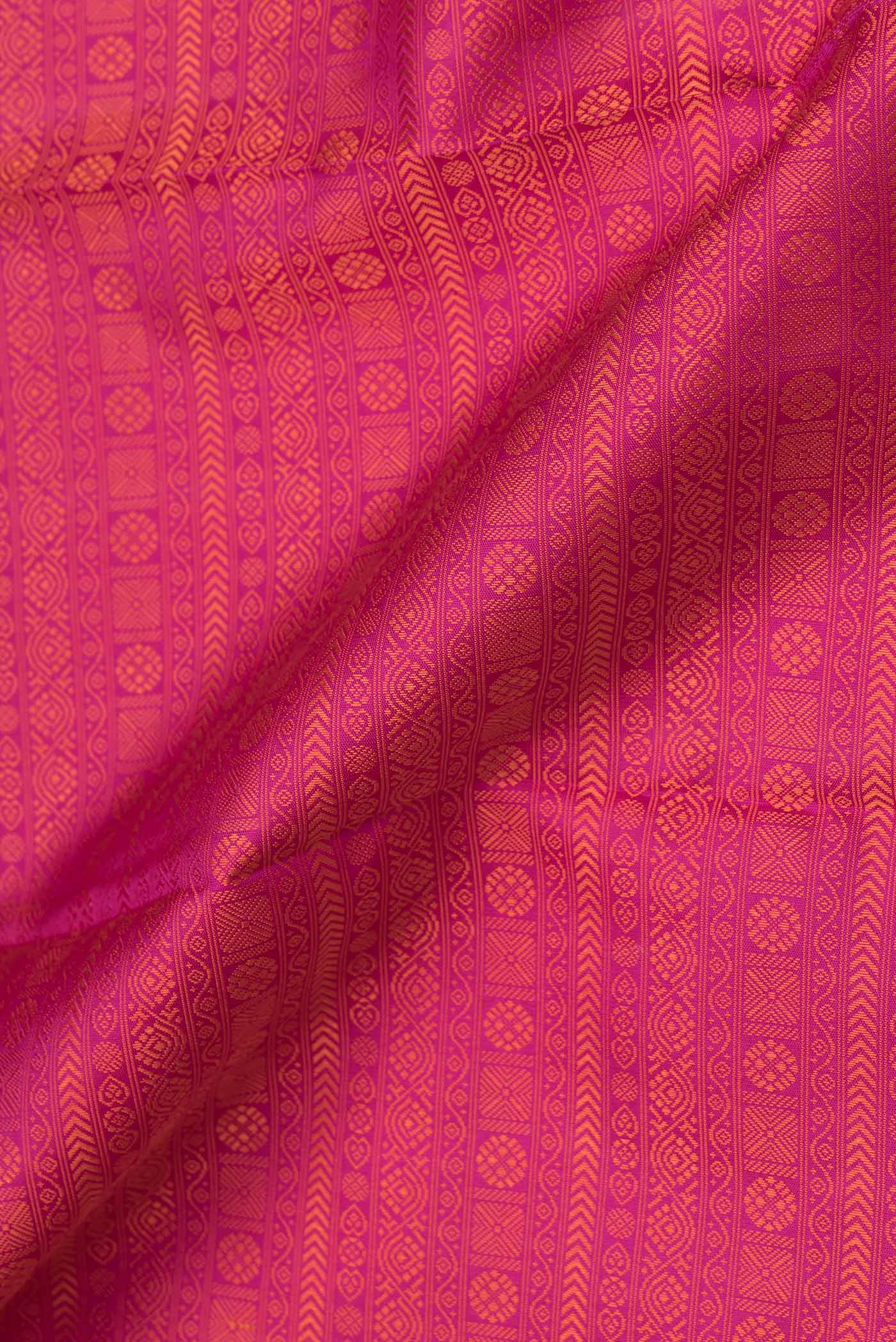 Close up of Pink Dual Tone Kanjivaram Saree with Jacquard design on the body and Plain Border.  displaying folds