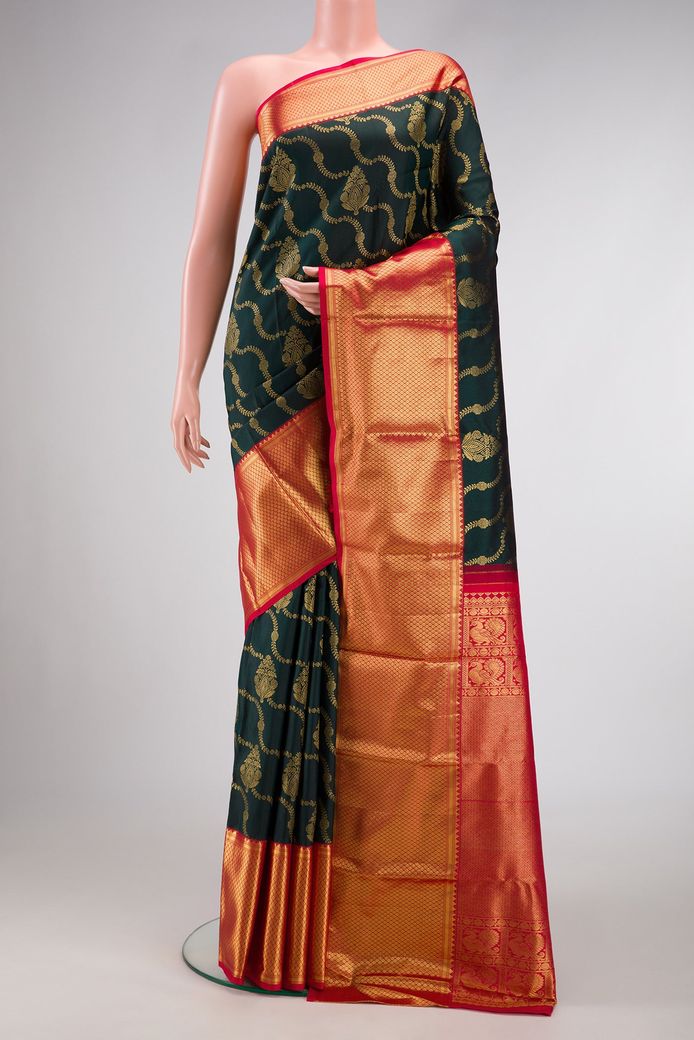 Bottle Green Dual Tone Kanjivaram Silk Saree with Zari Brocade on the body and Zari Border.  displayed on a mannequin
