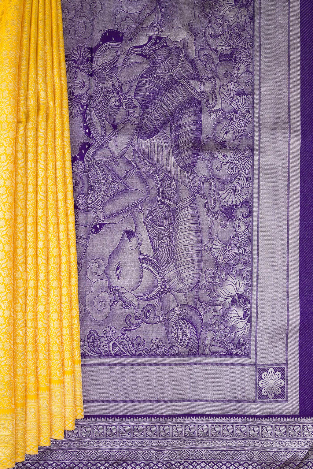 Pleats and pallu of Yellow Kanchipuram Silk Saree with Zari Brocade on the body and Fancy Border. 