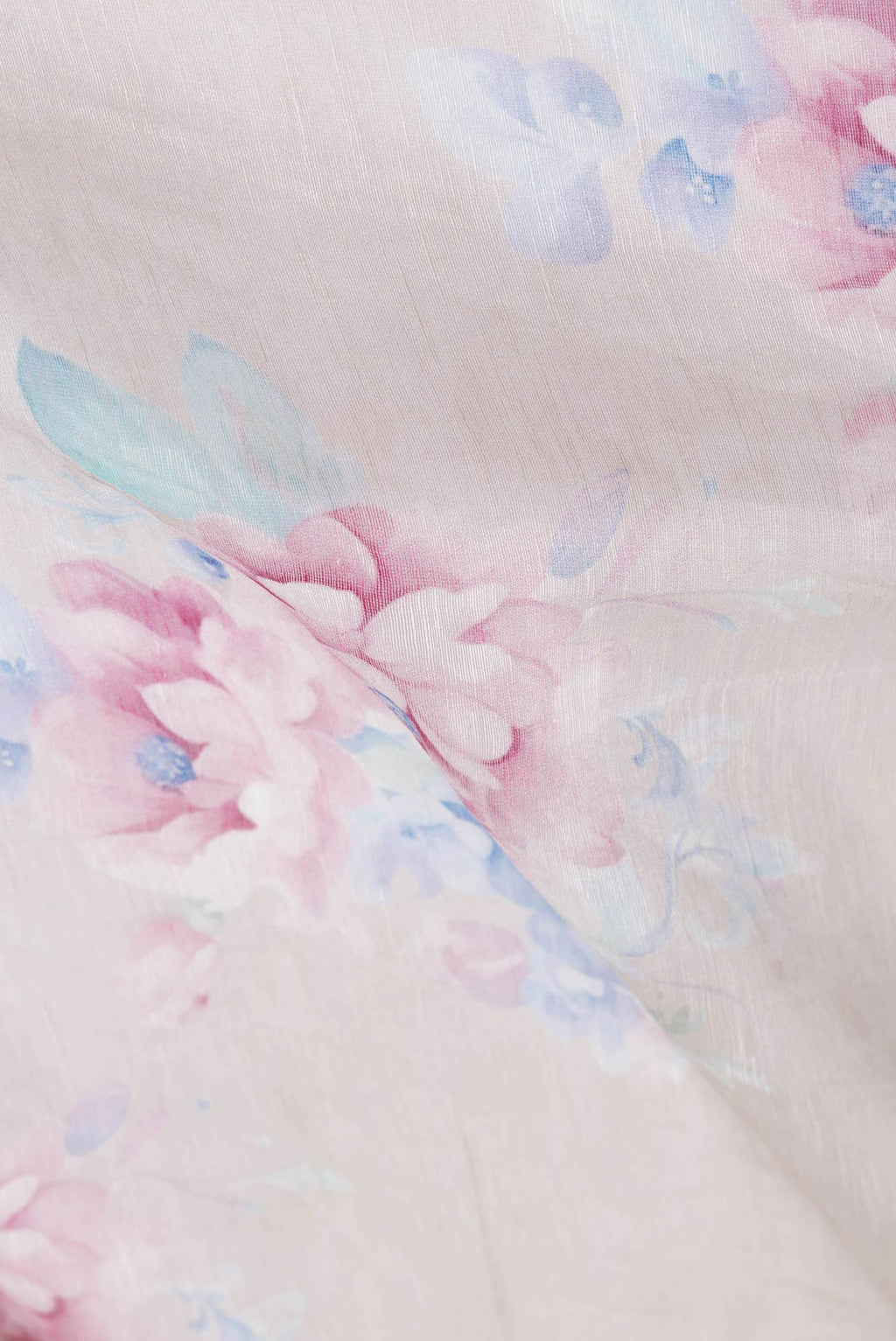 Close up of Beige Dual Tone Linen Saree with Printed design on the body and Zari Border.  displaying folds