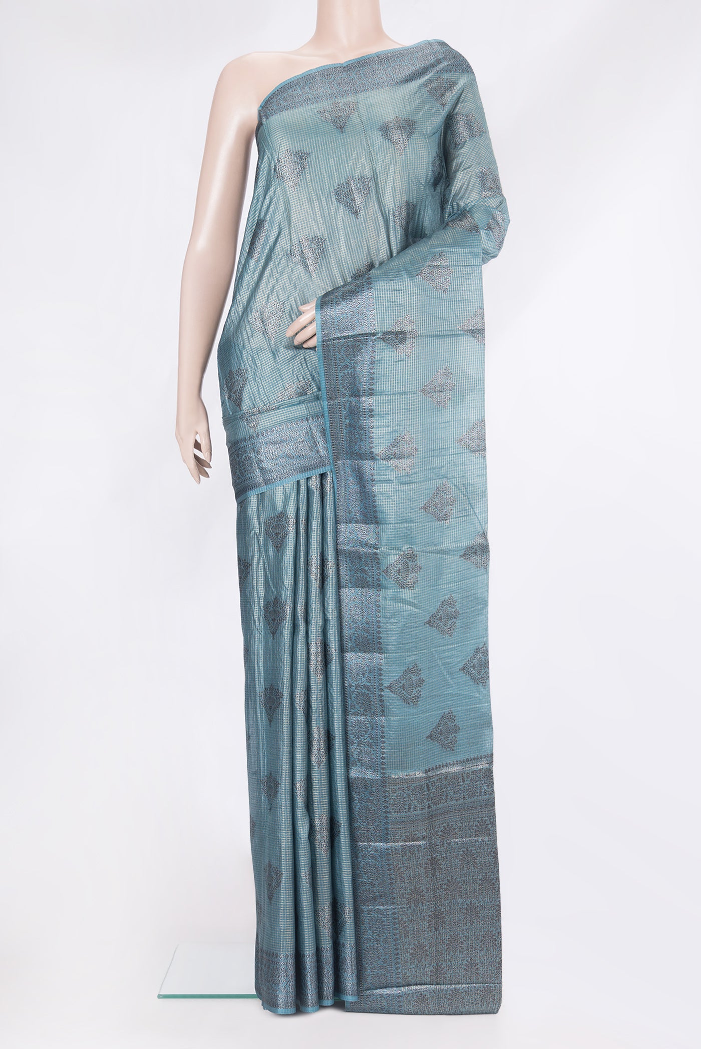 Grey Tussar Silk Saree with Checked design on the body and Zari Border.  displayed on a mannequin