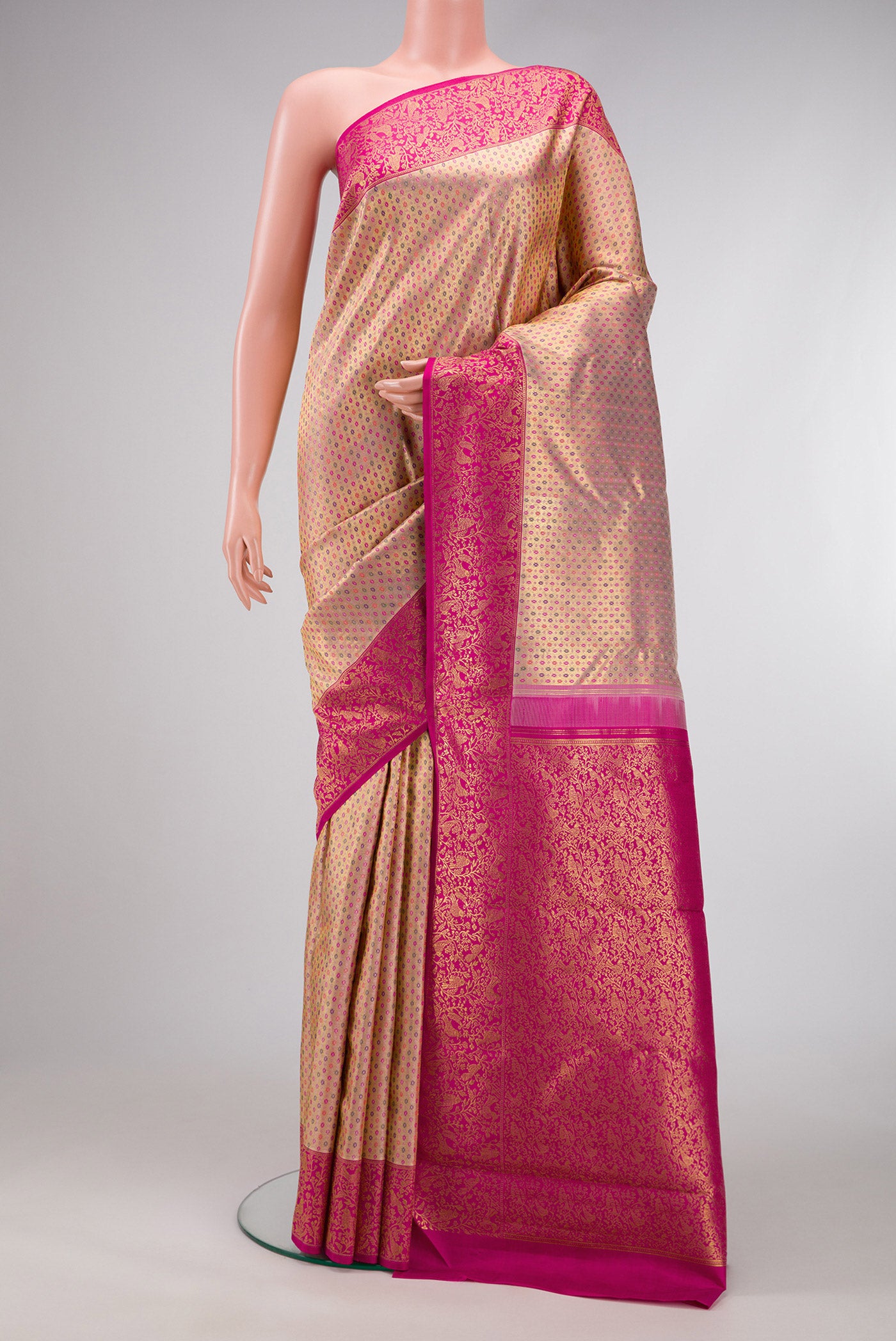 Pure Silk Pure Zari Golden Peach Dual Tone Kanjivaram Saree with Zari Brocade on the body and Zari Border.  displayed on a mannequin
