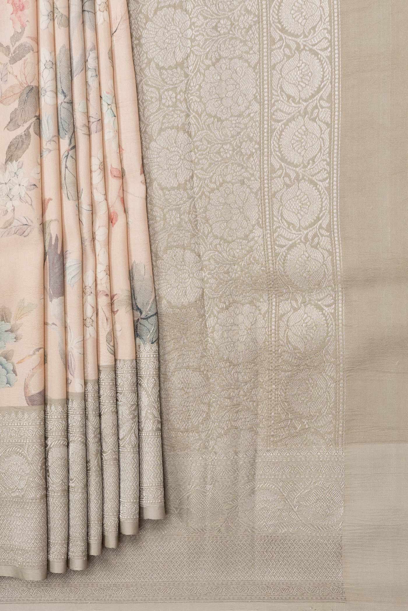 Pleats and pallu of Peach Dual Tone Tussar Saree with Zari Butta on the body and Zari Border. 