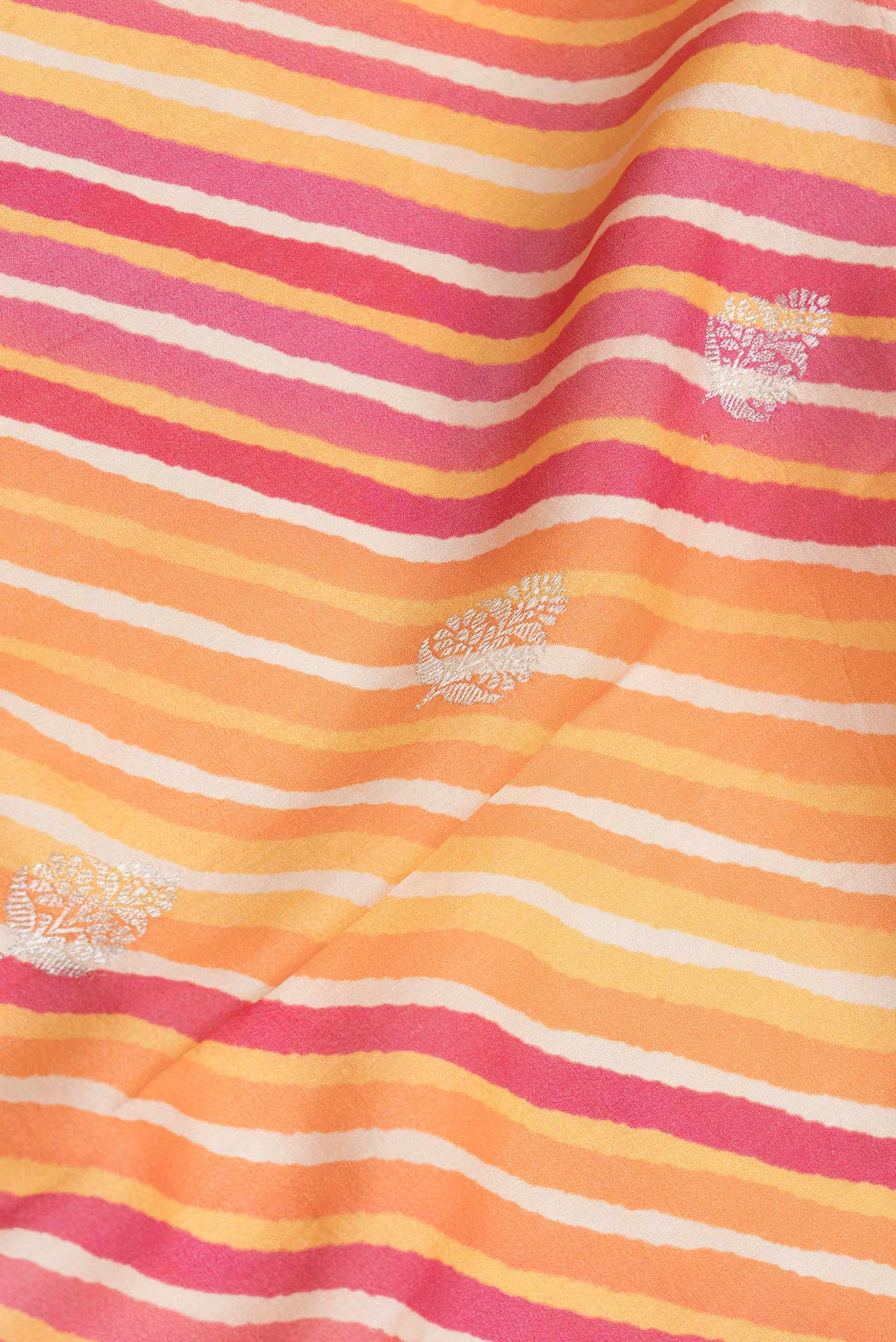 Close up of Pink and Orange Color Tussar Saree with Zari Butta on the body and Zari Border.  displaying folds