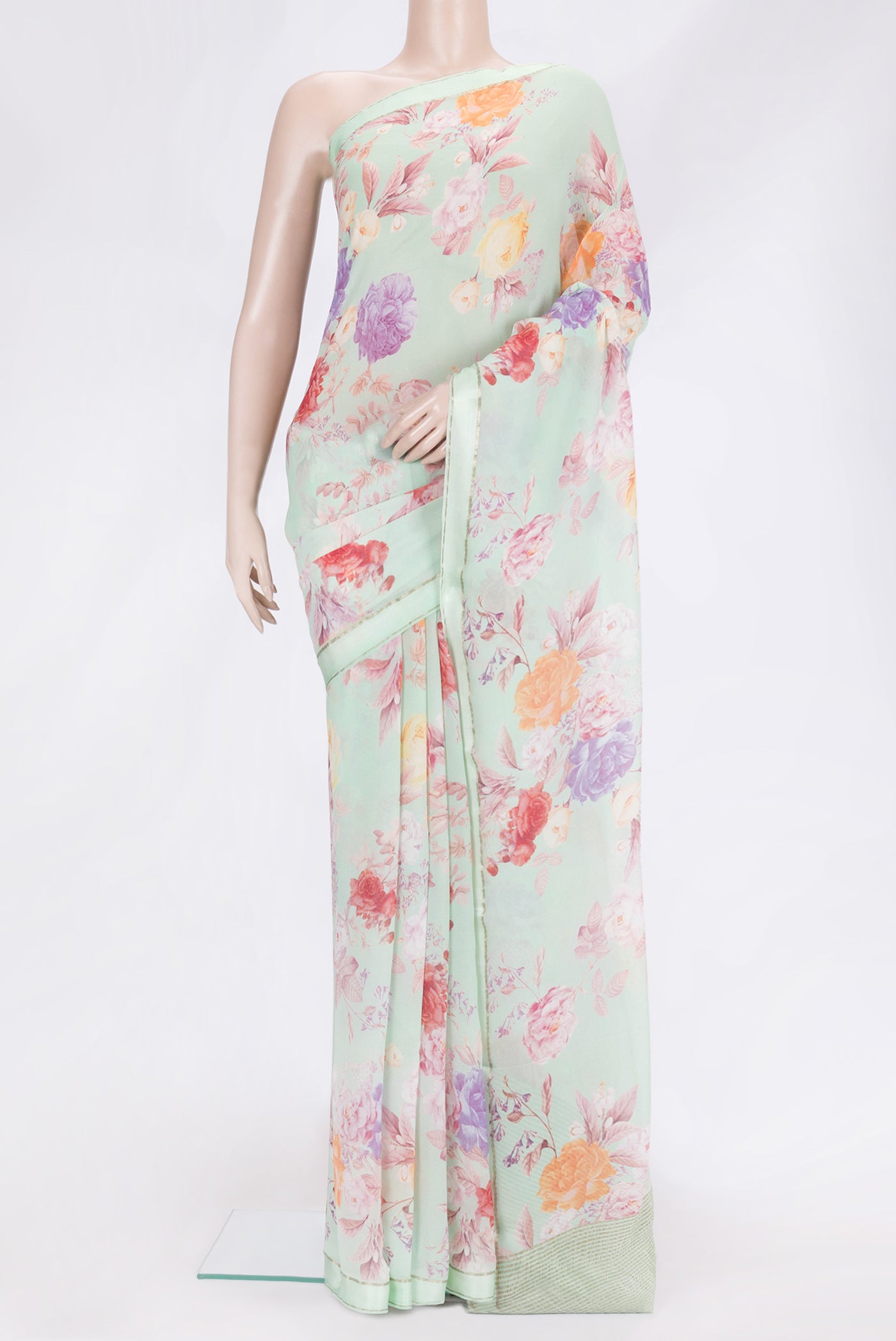 Pista Green Dual Tone Mysore Chiffon Saree with Printed design on the body and Thin Zari Line.  displayed on a mannequin