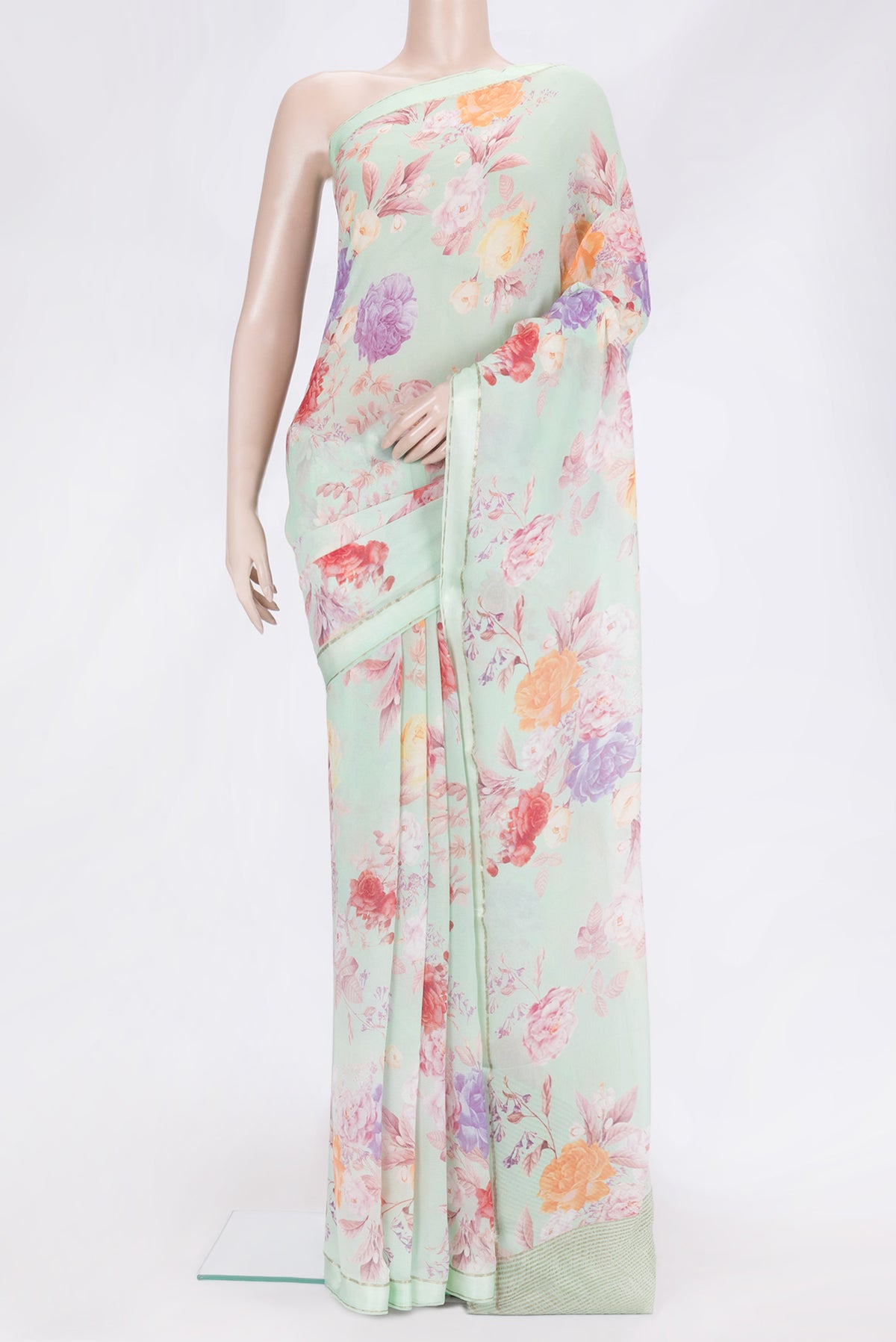 Pista Green Dual Tone Mysore Chiffon Saree with Printed design on the body and Thin Zari Line.  displayed on a mannequin