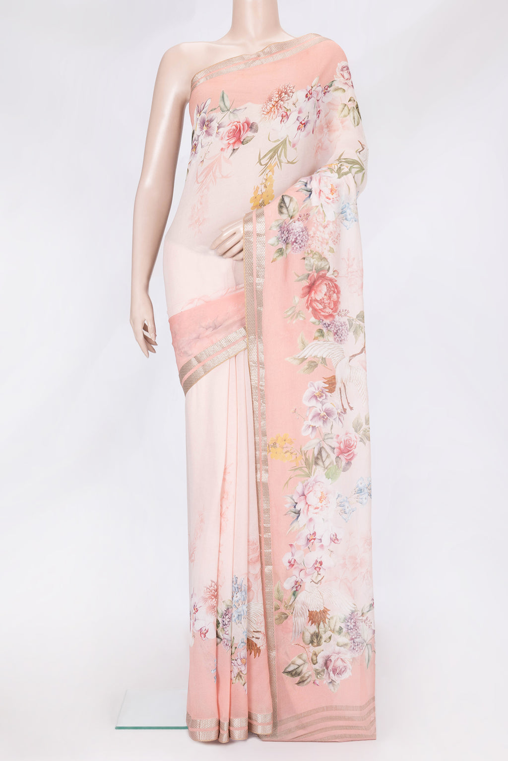 Peach Dual Tone Mysore Chiffon Saree with Printed design on the body and Zari Border.  displayed on a mannequin