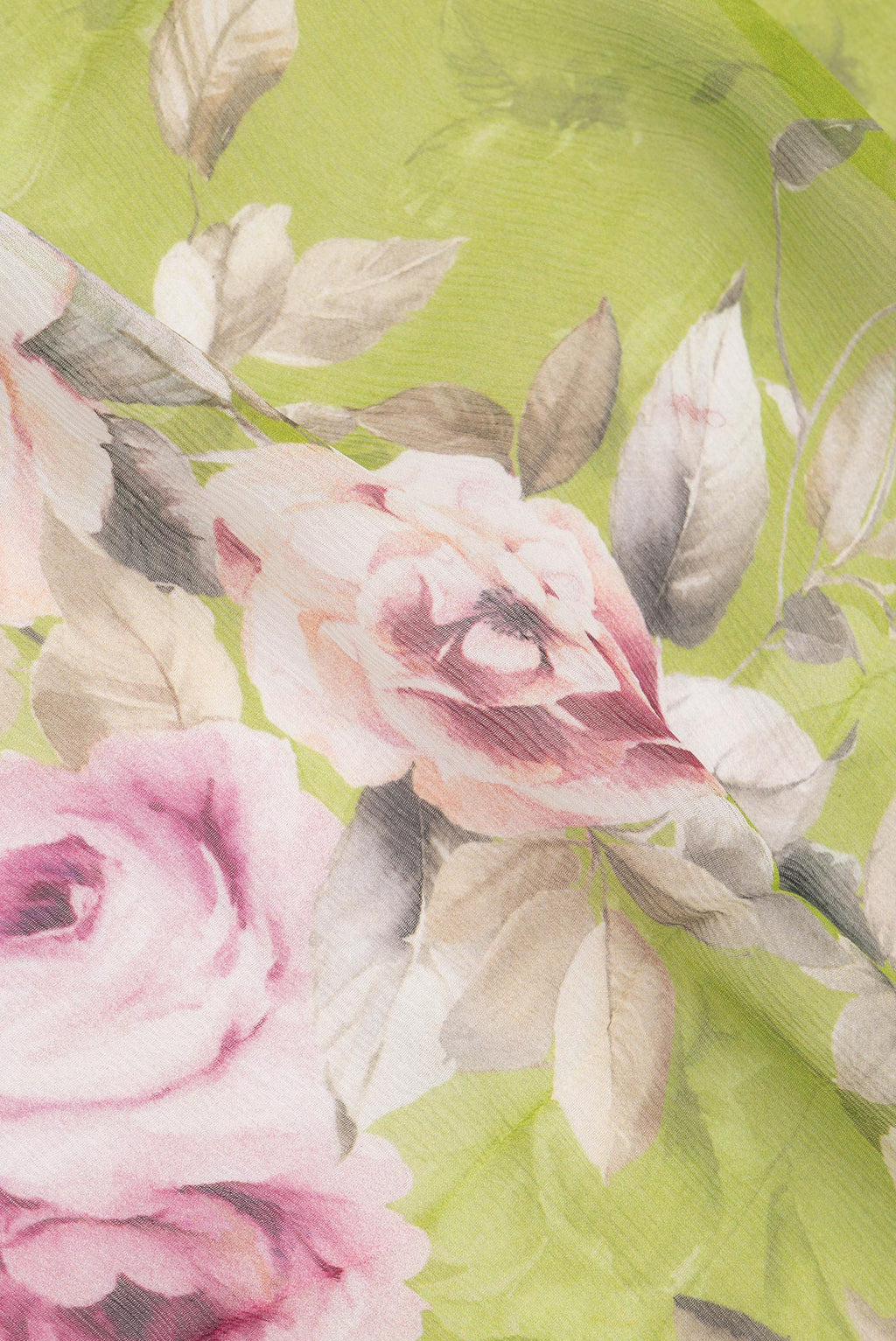 Close up of Parrot Green Mysore Chiffon Saree with Floral Print on the body and Zari Border.  displaying folds