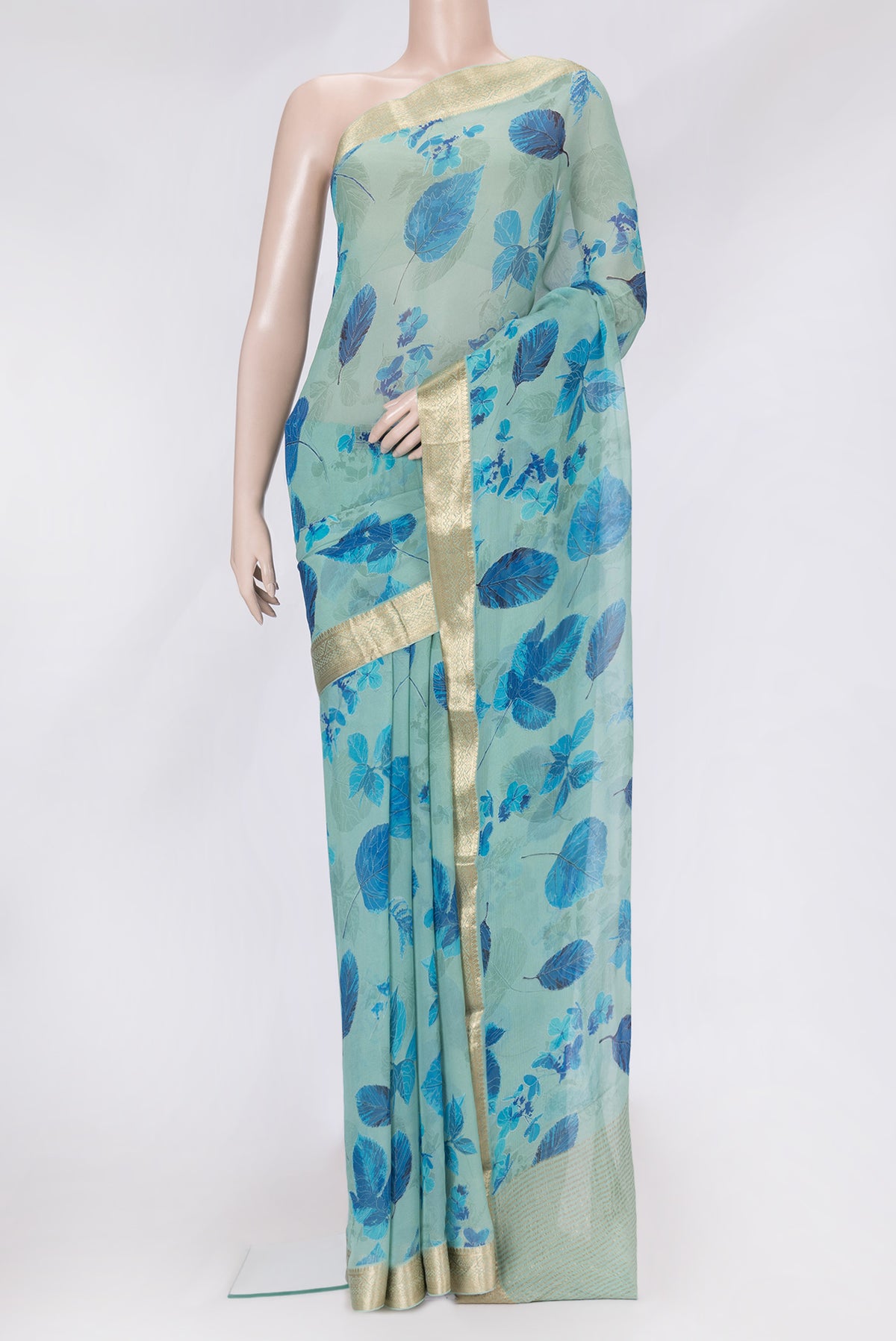 Sea Green Dual Tone Mysore Chiffon Saree with Printed design on the body and Zari Border.  displayed on a mannequin