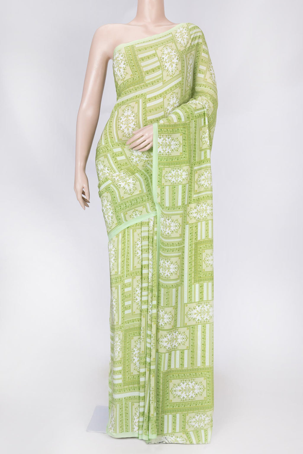 Pista Green Dual Tone Mysore Crepe Saree with Printed design on the body and Printed Border displayed on a mannequin