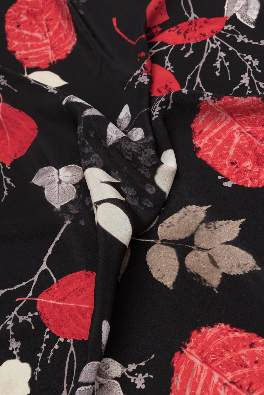 Close up of Black Dual Tone Mysore Crepe Saree with Printed design on the body and Without Border.  displaying folds