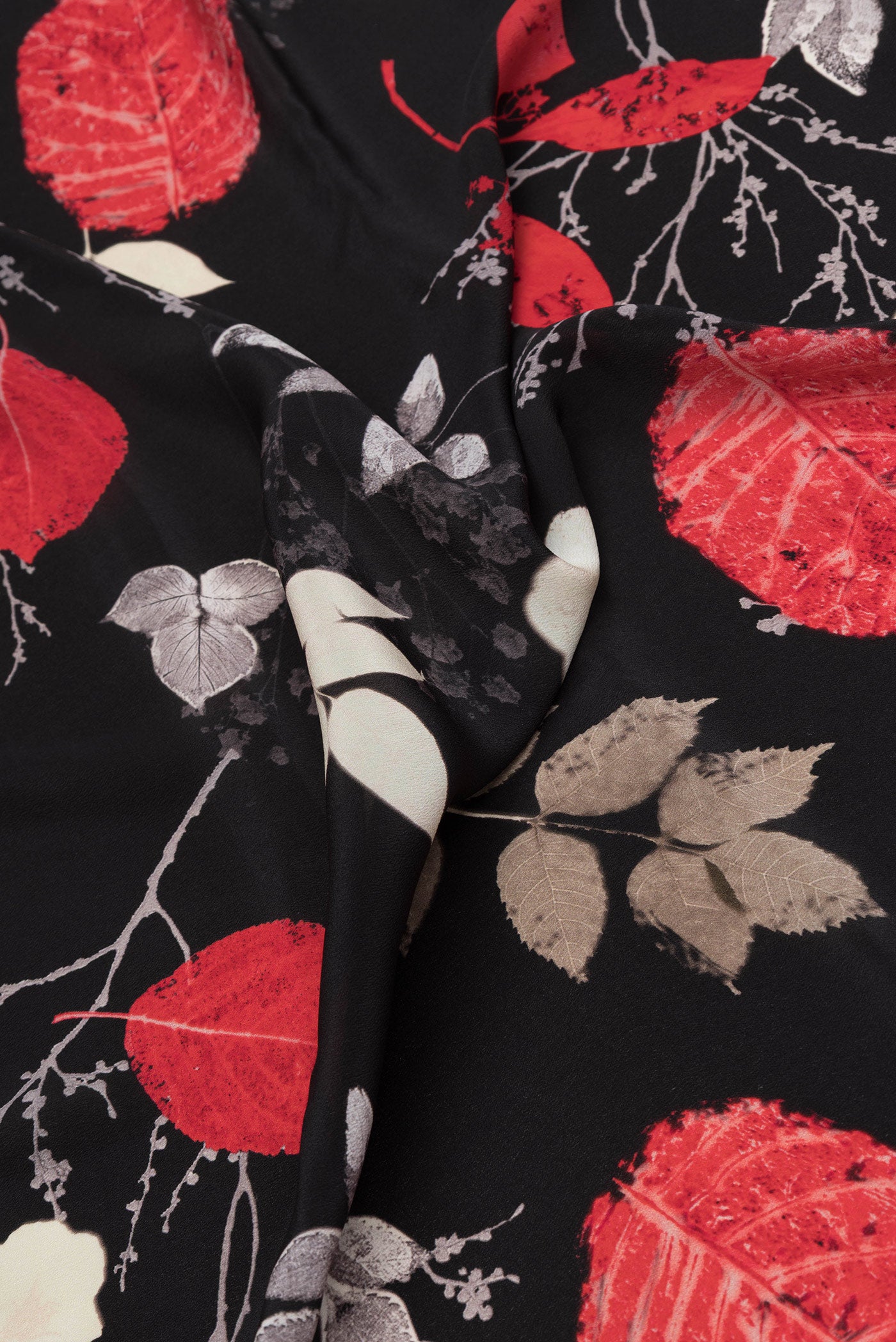 Close up of Black Dual Tone Mysore Crepe Saree with Printed design on the body and Without Border.  displaying folds