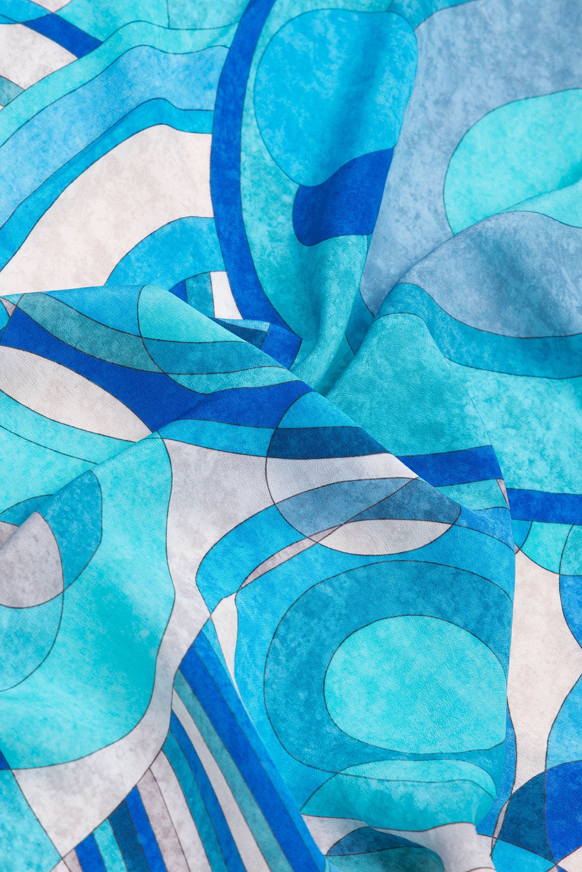Close up of Sky Blue Dual Tone Mysore Crepe Saree with Printed design on the body and Plain Border.  displaying folds