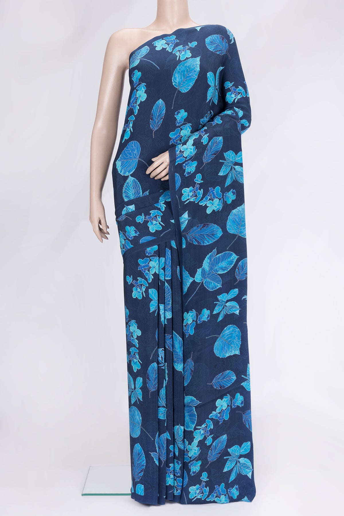 Navy Blue Dual Tone Mysore Crepe Saree with Printed design on the body and Without Border.  displayed on a mannequin