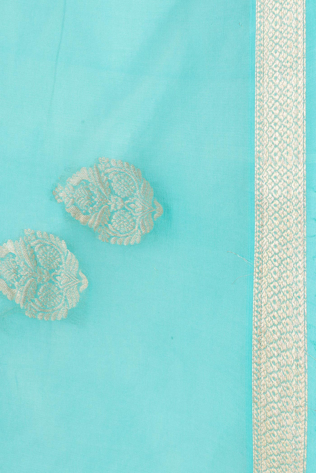 Border image of Sky Blue Dual Tone Mysore Georgette Saree with Zari Butta on the body and Zari Border. 