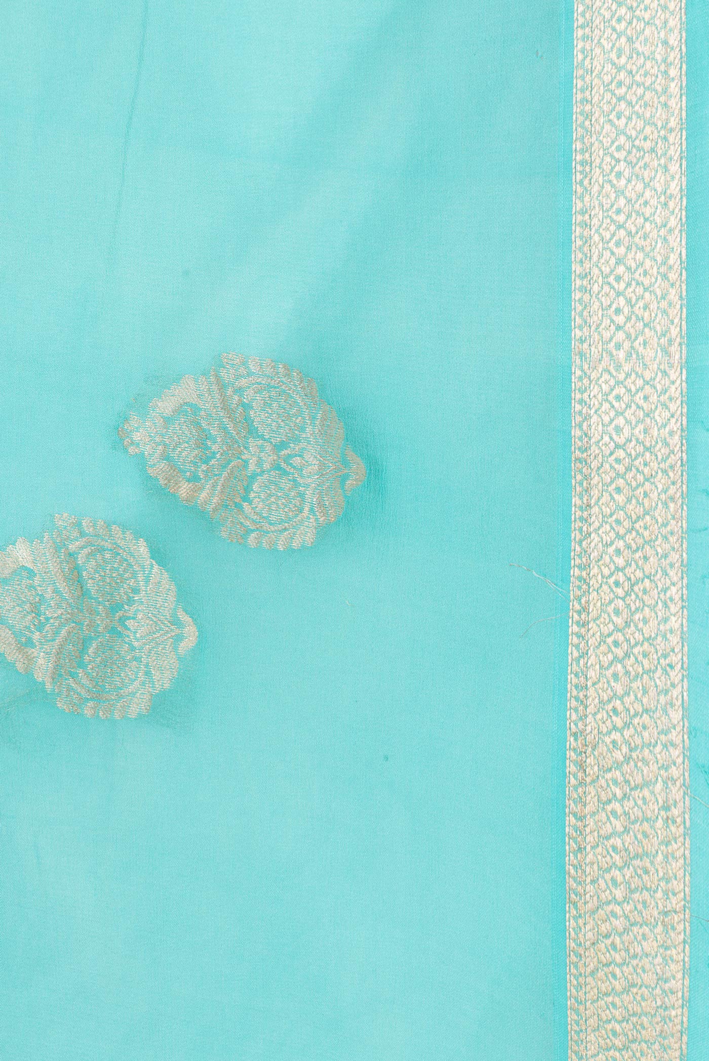 Border image of Sky Blue Dual Tone Mysore Georgette Saree with Zari Butta on the body and Zari Border. 