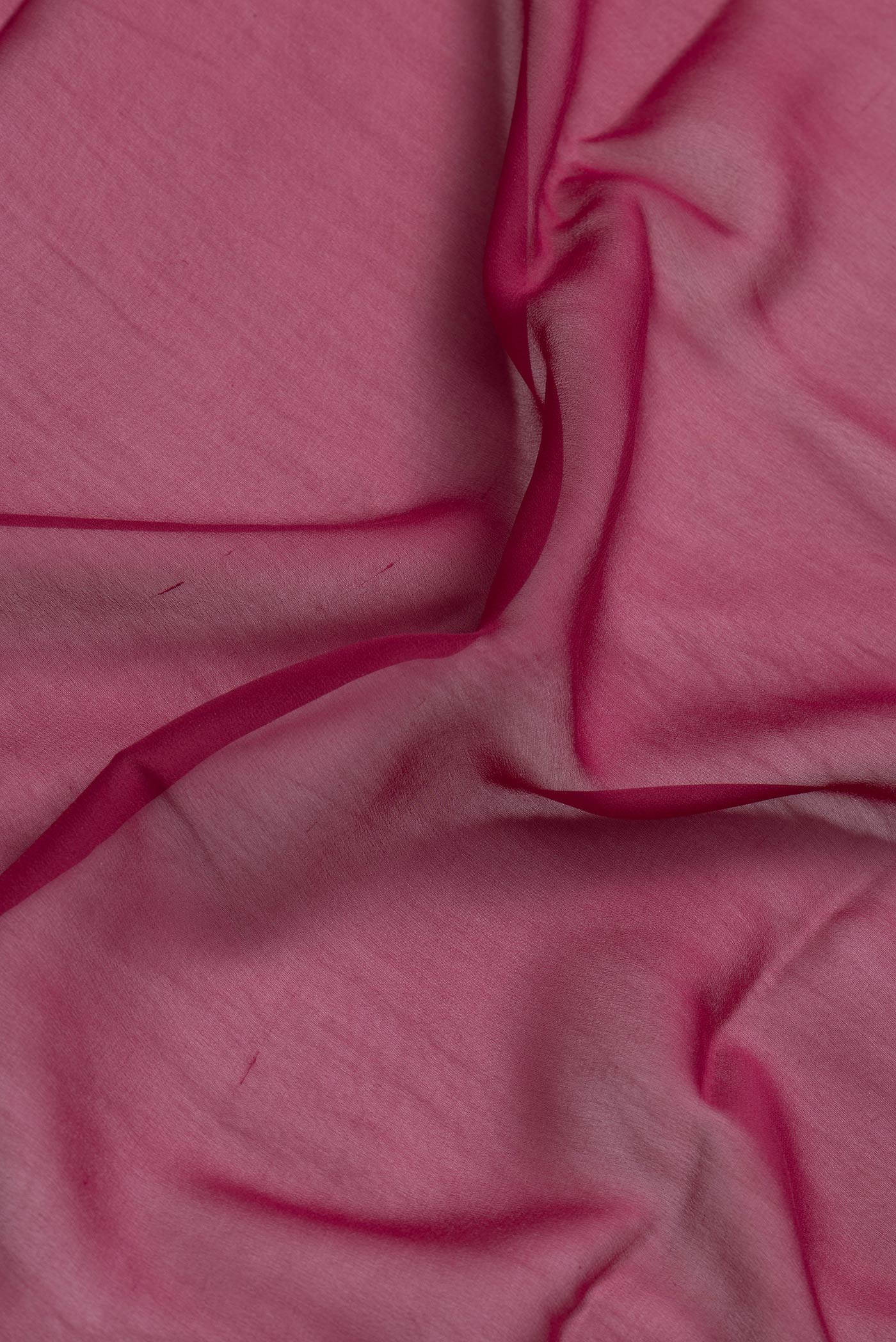 Border image of Magenta Dual Tone Georgette Saree with Plain Body and Temple Border. 