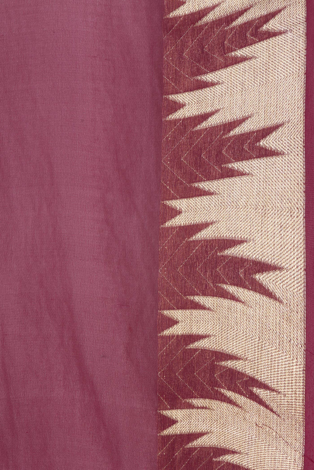 Close up of Magenta Dual Tone Georgette Saree with Plain Body and Temple Border.  displaying folds