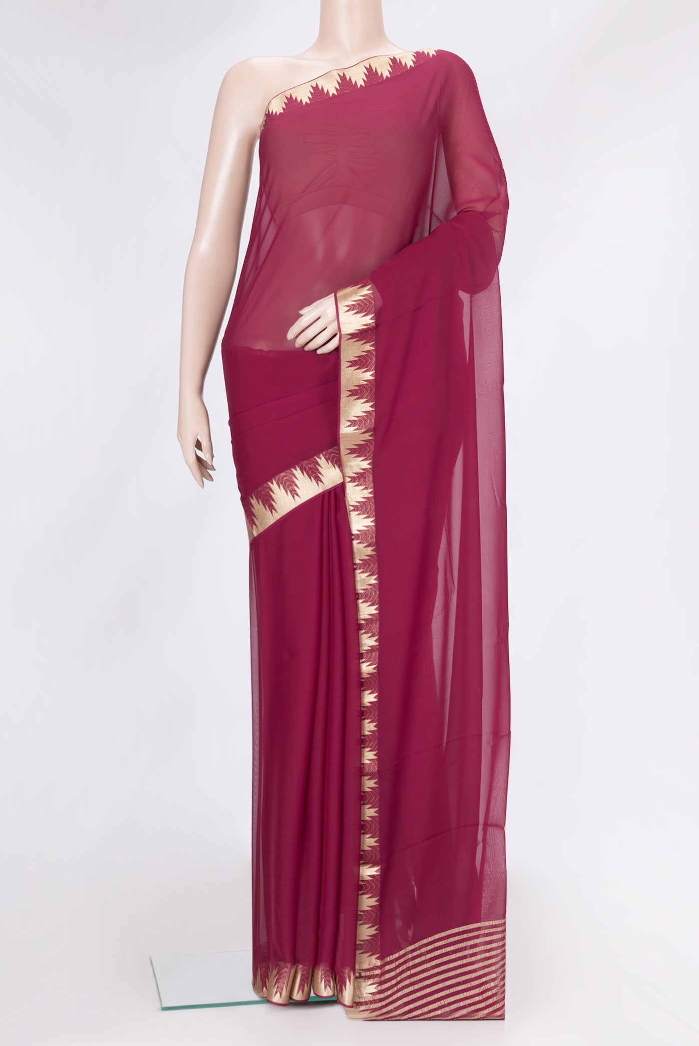 Magenta Dual Tone Georgette Saree with Plain Body and Temple Border.  displayed on a mannequin