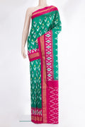 Pure Silk Green Pochampally Saree with Ikat design on the body and Ikat Border.  displayed on a mannequin