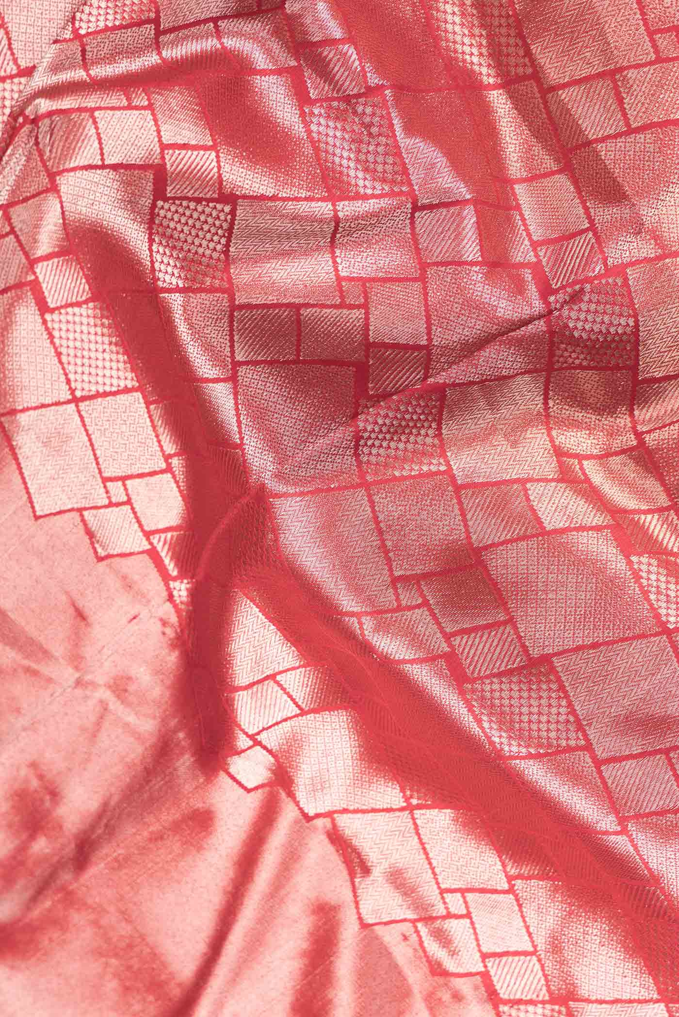 Close up of Red Dual Tone Banarasi Silk Saree with Zari Brocade on the body and Zari Border.  displaying folds