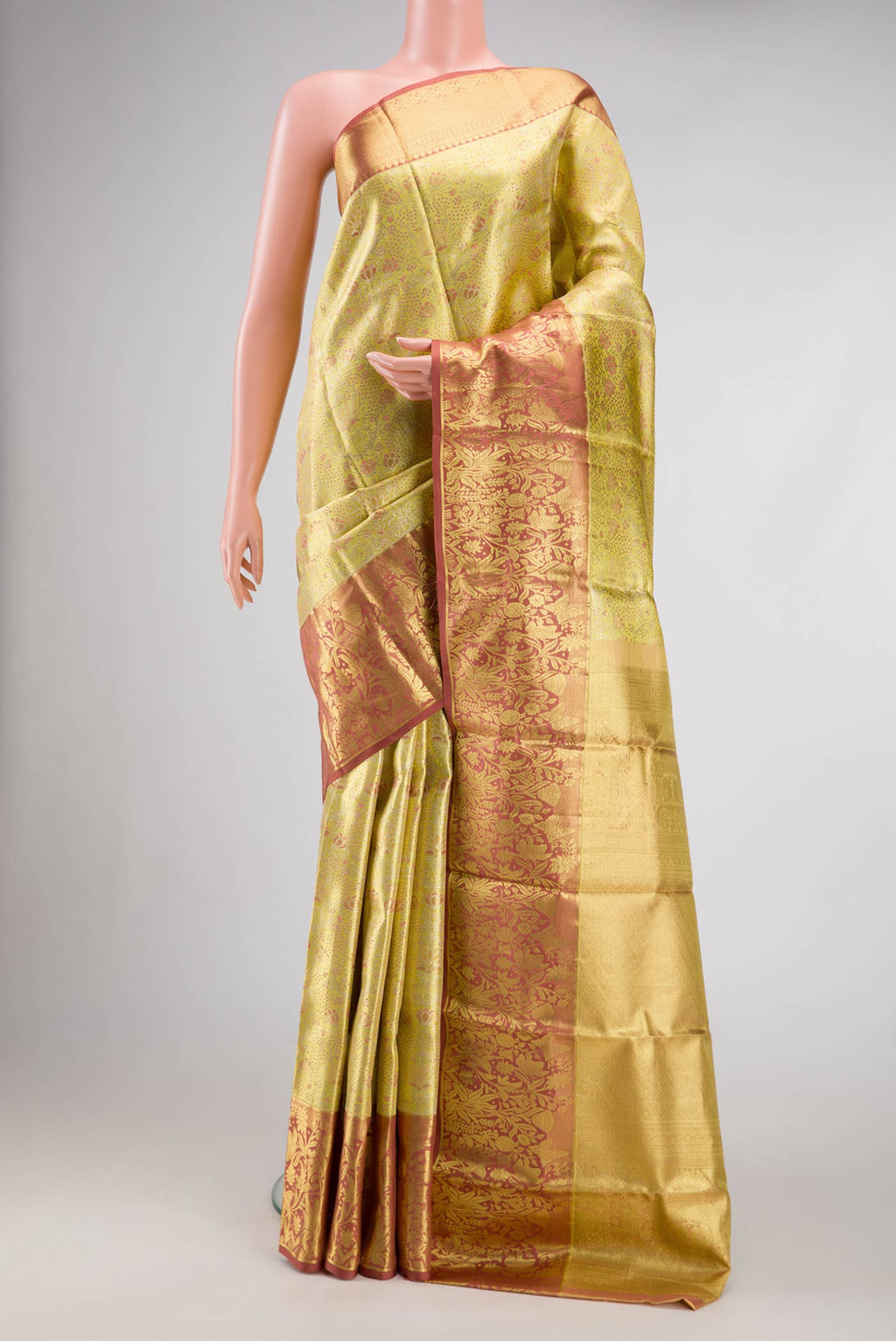 Gold Dual Tone Kanchipuram Tissue Silk Saree with Zari Brocade on the body and Zari Border.  displayed on a mannequin