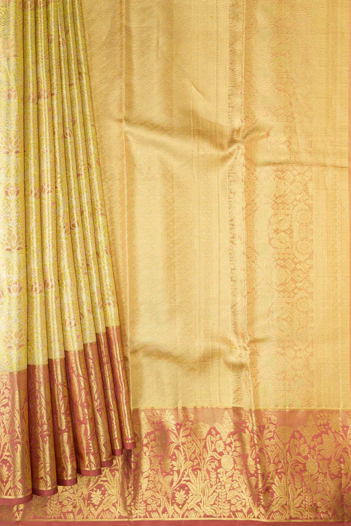 Pleats and pallu of Gold Dual Tone Kanchipuram Tissue Silk Saree with Zari Brocade on the body and Zari Border. 