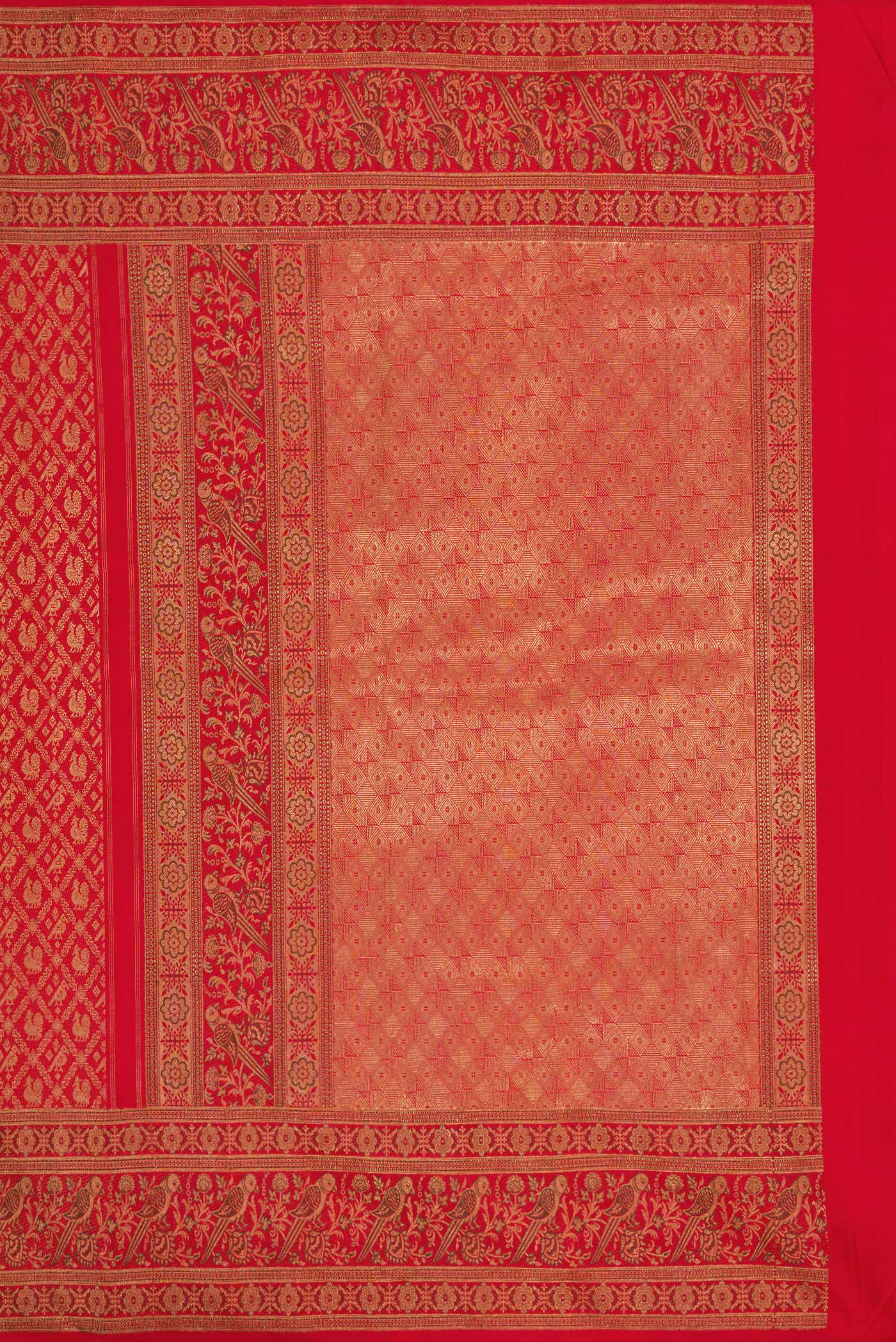 Close up image of the pallu of Pure Silk Pure Zari Red Dual Tone Kanjivaram Saree with Zari Brocade on the body and Zari Border. 