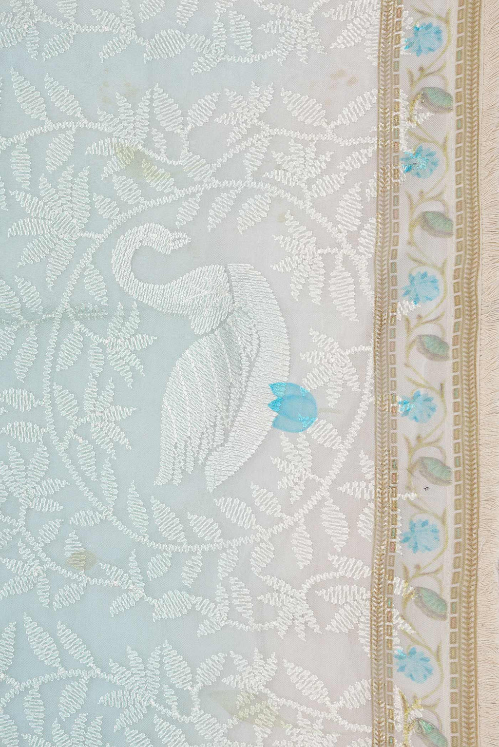 Border image of Light Blue Dual Tone Organza Silk Saree with Embroidery on the body and Embroidery Border. 