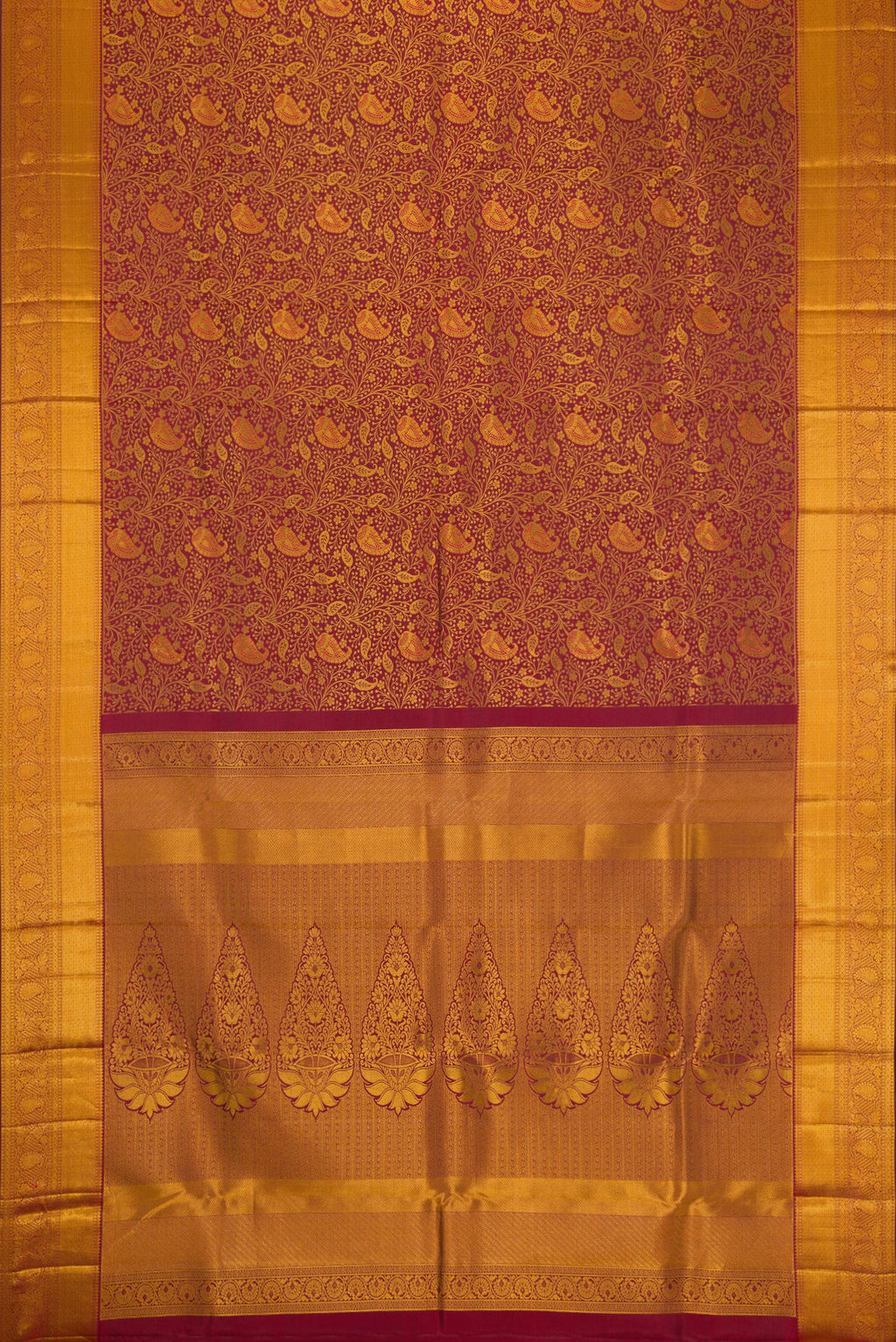 Flat view of Maroon Dual Tone Kanjivaram Silk Saree with Zari Brocade on the body and Zari Border. 