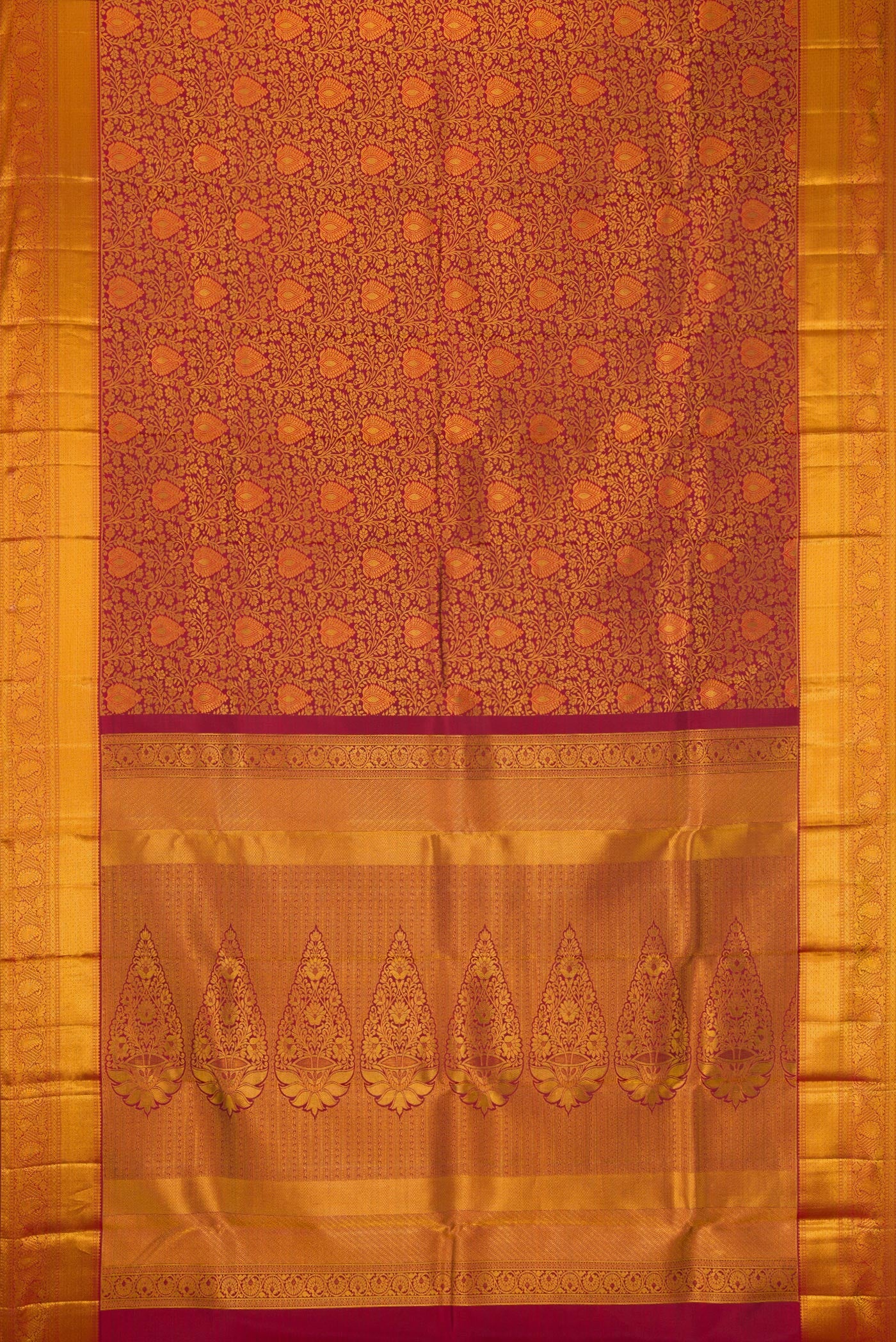 Flat view of Maroon Dual Tone Kanjivaram Silk Saree with Zari Brocade on the body and Zari Border. 