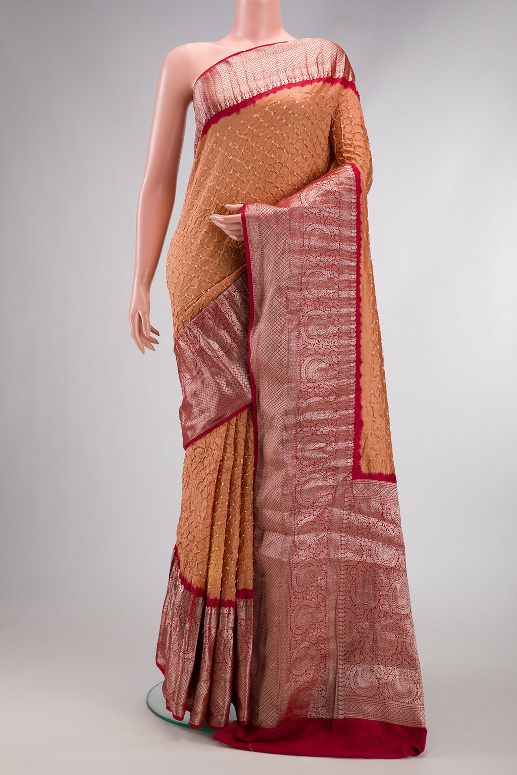 Brown Dual Tone Bandhani Silk Saree with Bandhani Print on the body and Zari Border.  displayed on a mannequin