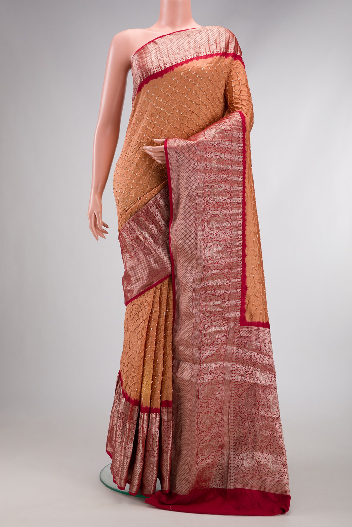 Brown Dual Tone Bandhani Silk Saree with Bandhani Print on the body and Zari Border.  displayed on a mannequin