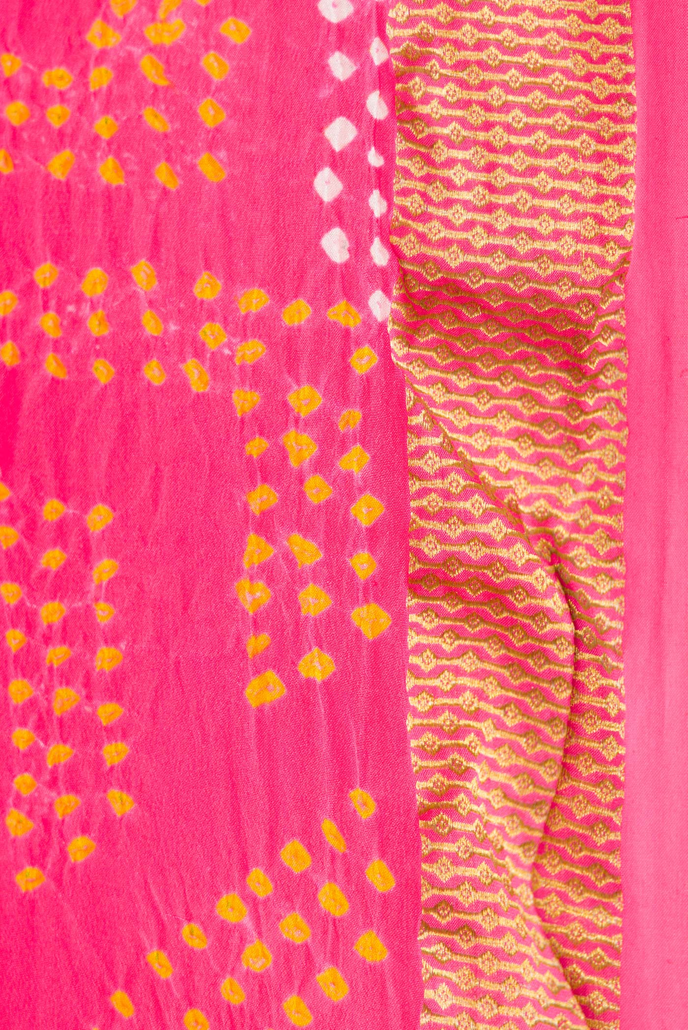 Border image of Pink Dual Tone Bandhani Silk Saree with Bandhani Print on the body and Zari Border. 