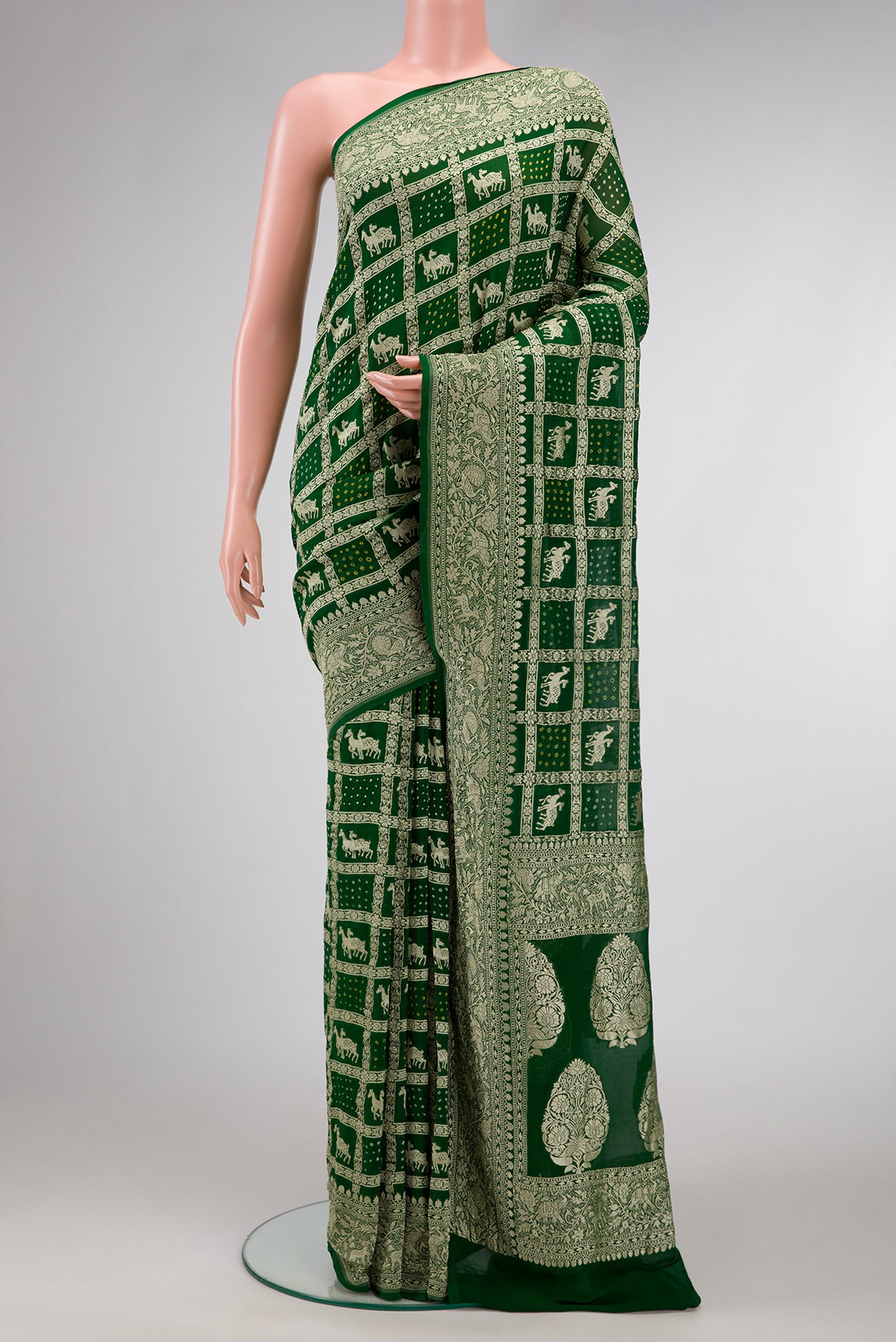 Bottle Green Dual Tone Banarasi Georgette Saree with Zari Brocade on the body and Zari Border.  displayed on a mannequin
