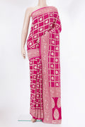 Dark Pink Bandhani Georgette Saree with Zari Brocade on the body and Zari Border.  displayed on a mannequin