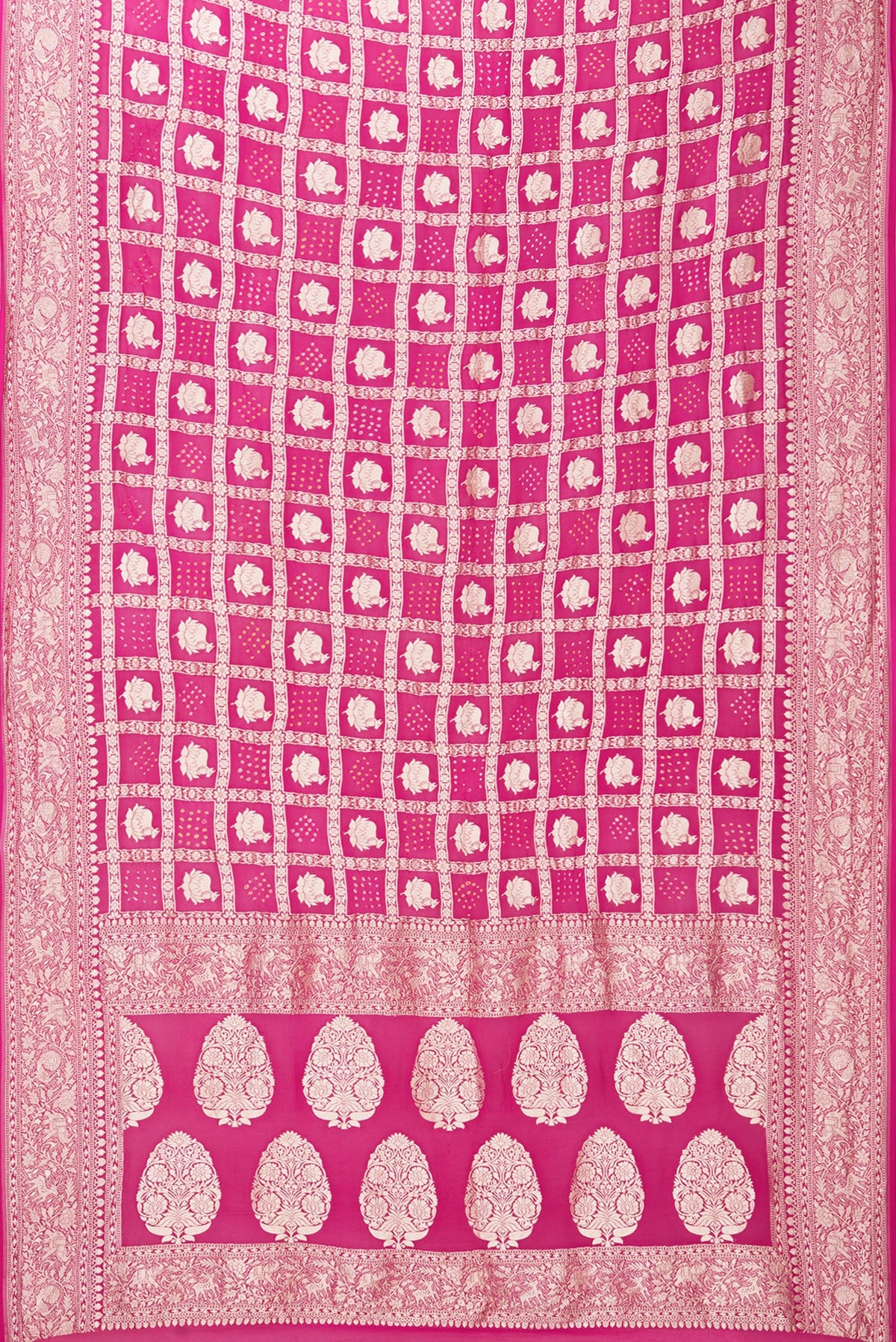 Flat view of Dark Pink Bandhani Georgette Saree with Zari Brocade on the body and Zari Border. 