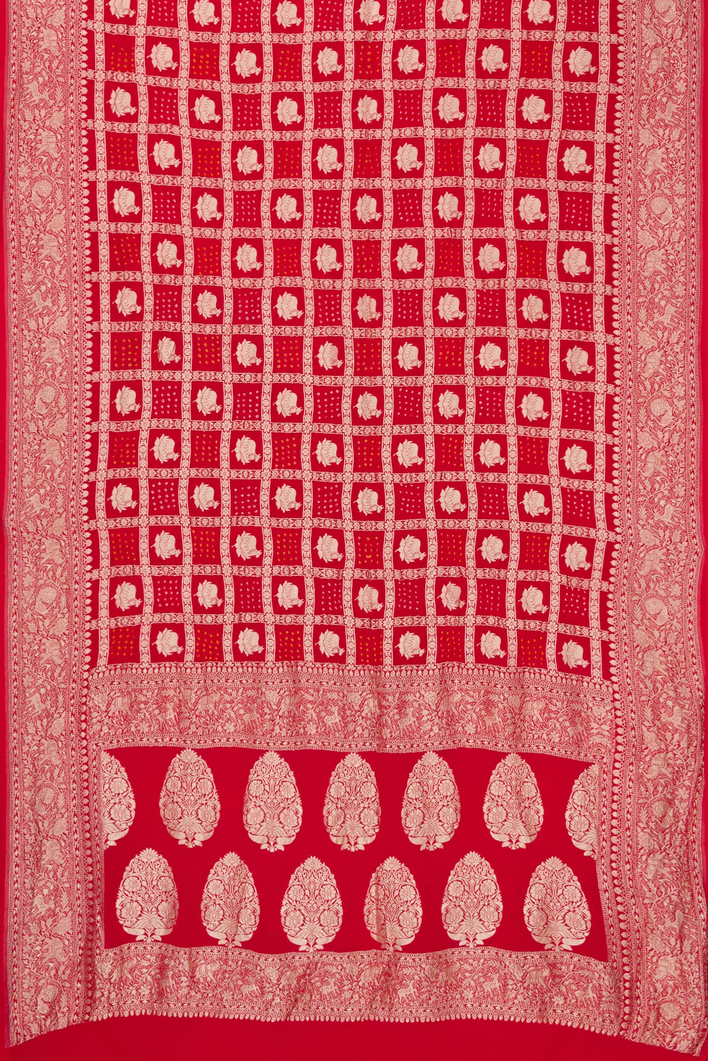 Flat view of Red Dual Tone Bandhani Silk Saree with Zari Brocade on the body and Zari Border. 