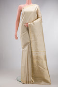 Pure Silk Pure Zari Off White Dual Tone Kanjivaram Saree with Zari Brocade on the body and Zari Border.  displayed on a mannequin