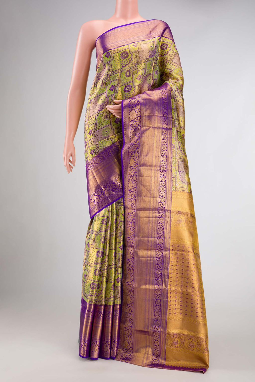 Green Dual Tone Kanchipuram Tissue Silk Saree with Zari Brocade on the body and Zari Border.  displayed on a mannequin