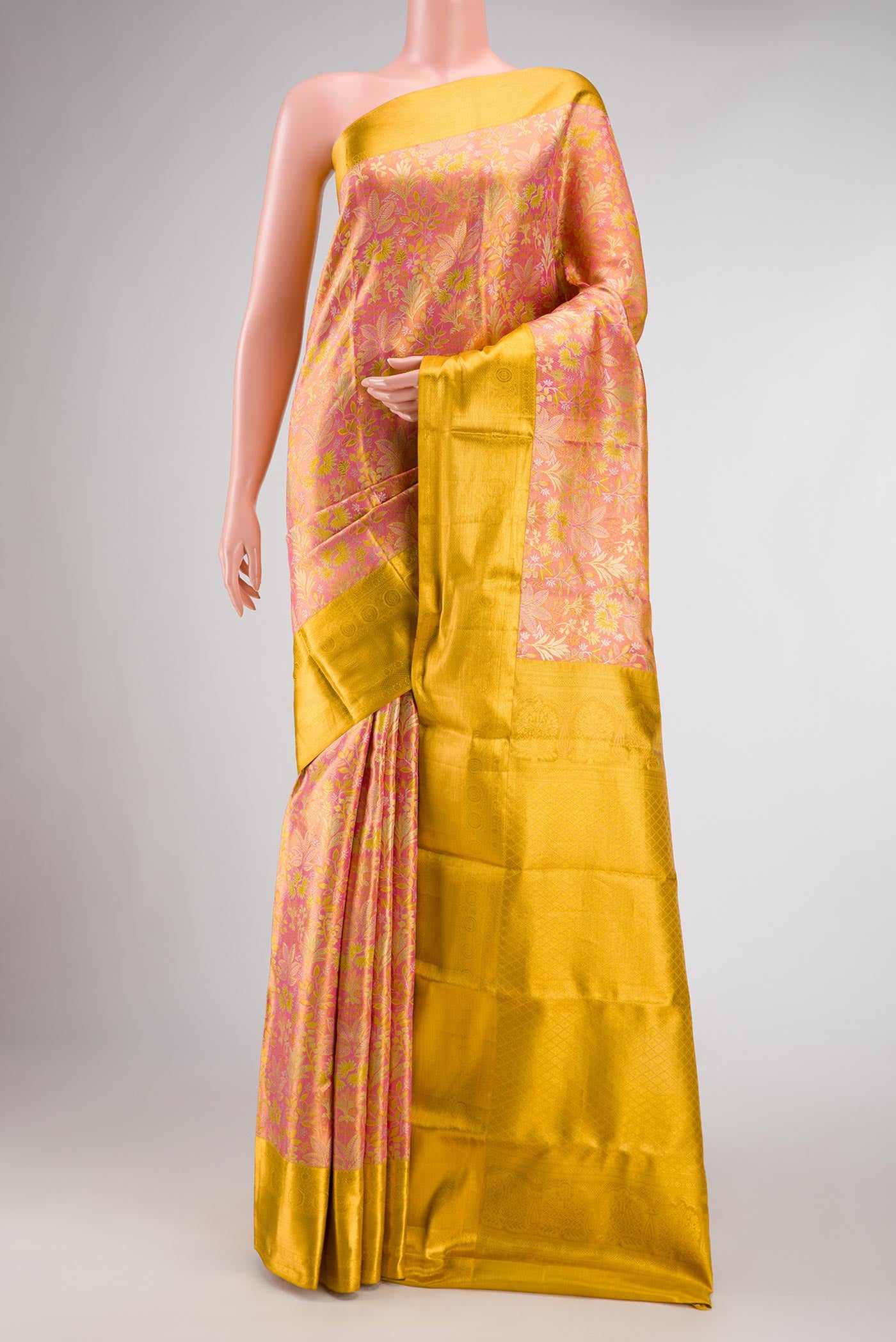 Pink Dual Tone Kanchipuram Tissue Silk Saree with Zari Brocade on the body and Zari Border.  displayed on a mannequin