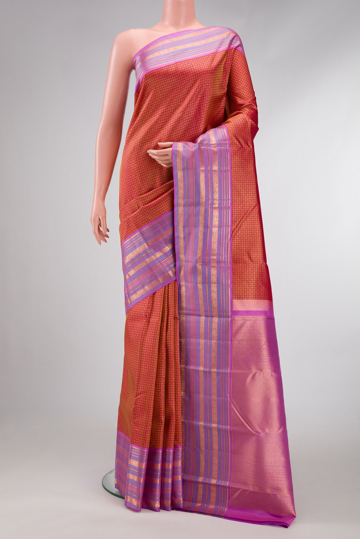 Red Dual Tone Kanjivaram Silk Saree with Zari Brocade on the body and Zari Border.  displayed on a mannequin