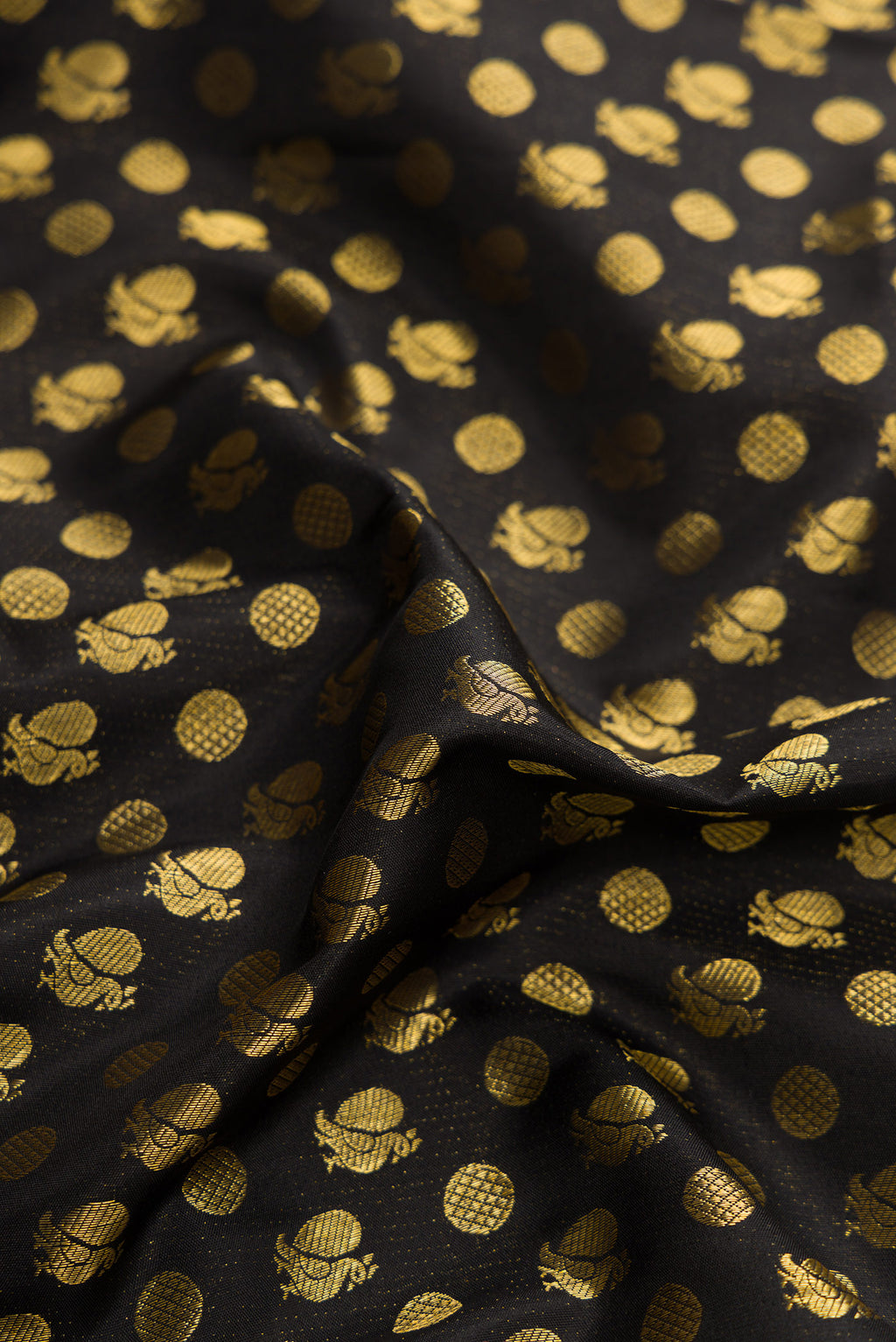 Close up of Black Dual Tone Kanjivaram Silk Saree with Zari Brocade on the body and Fancy Border.  displaying folds